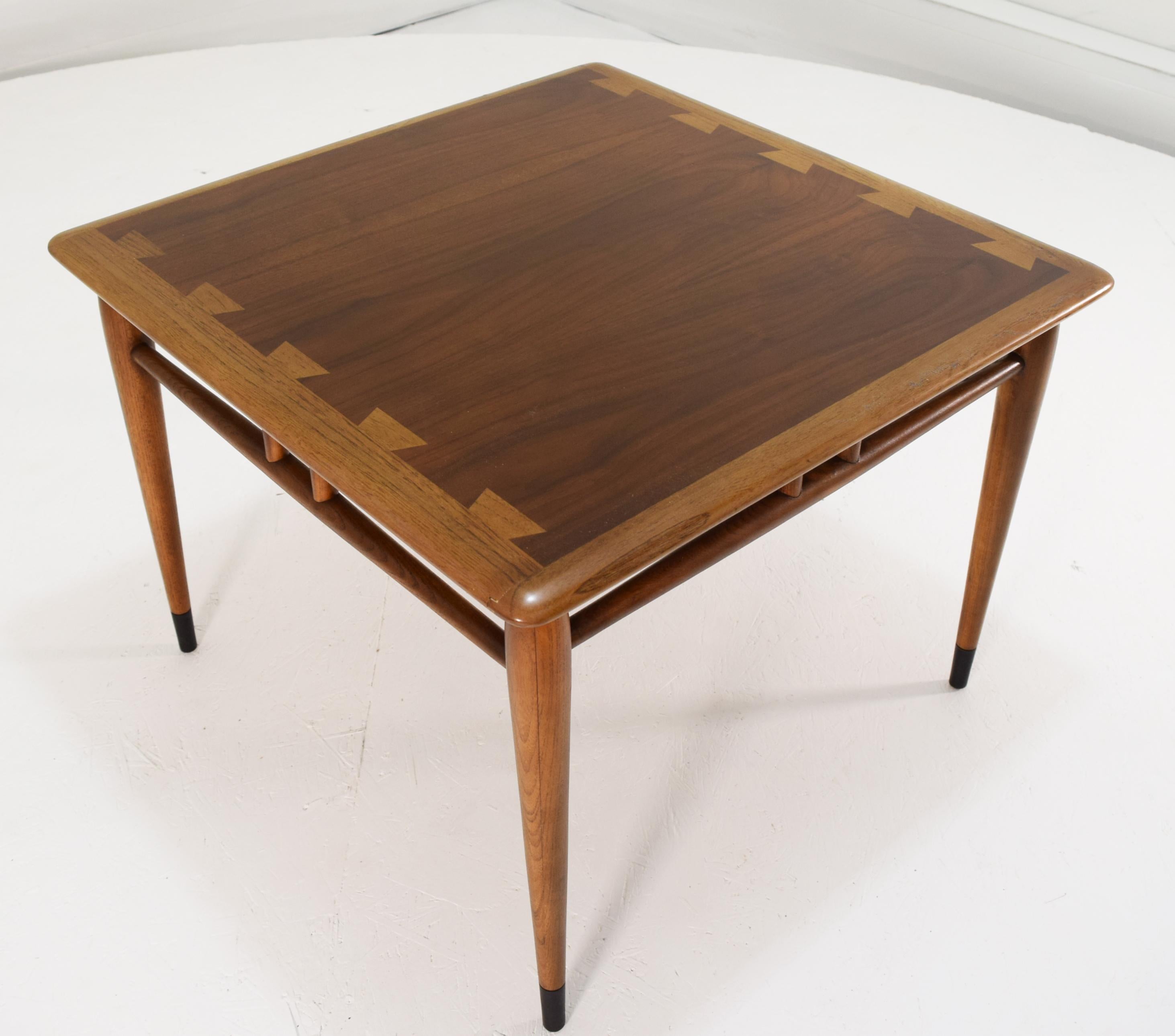 Acclaim, Lane Alta-Vista, circa 1970, 27 x 27 x 20 inches tall.
A large square table with walnut finished solid block banding, ebony finish to feet and walnut top. Stands taller than most from the series and is ideal for use as an end or display