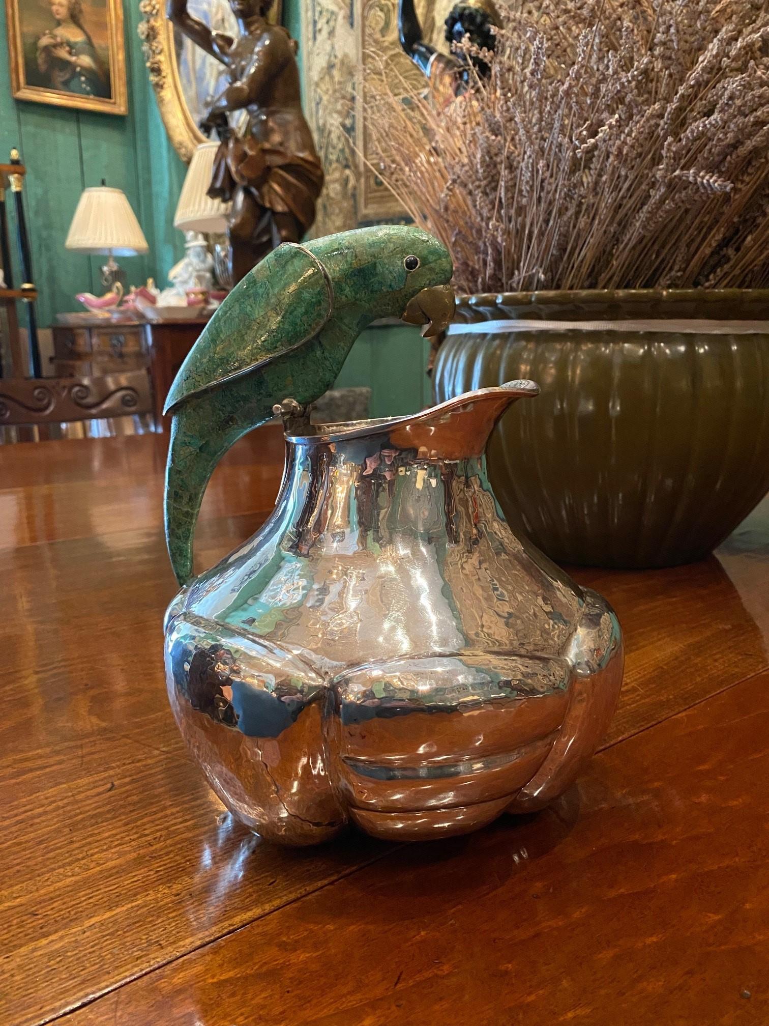 Large centerpiece serving silver - plated hand hammered lobed pitcher bowl from the renowned Taxco Mexico workshop of the Great Emilia Castillo. Emilia descends from a fine family tree of renowned Taxco metal artisans and jewelers . Pitcher flanked