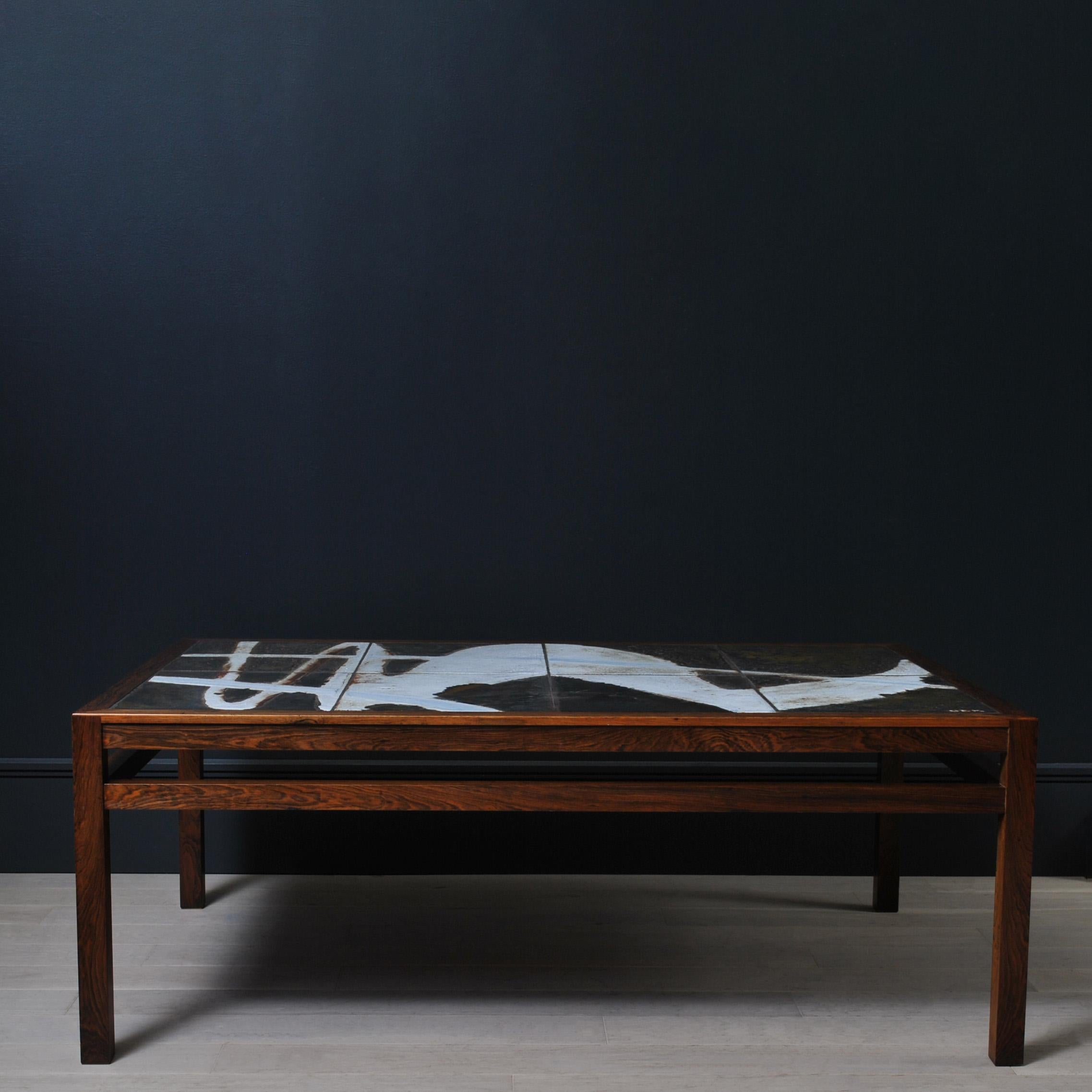 A truly unique ceramic art table by Danish artist Ole Bjørn Krüger. A large and substantial piece of design furniture. Visually striking and bold design in the graphic style. Produced in Denmark circa 1960. in lovely condition. Cleaned and polished