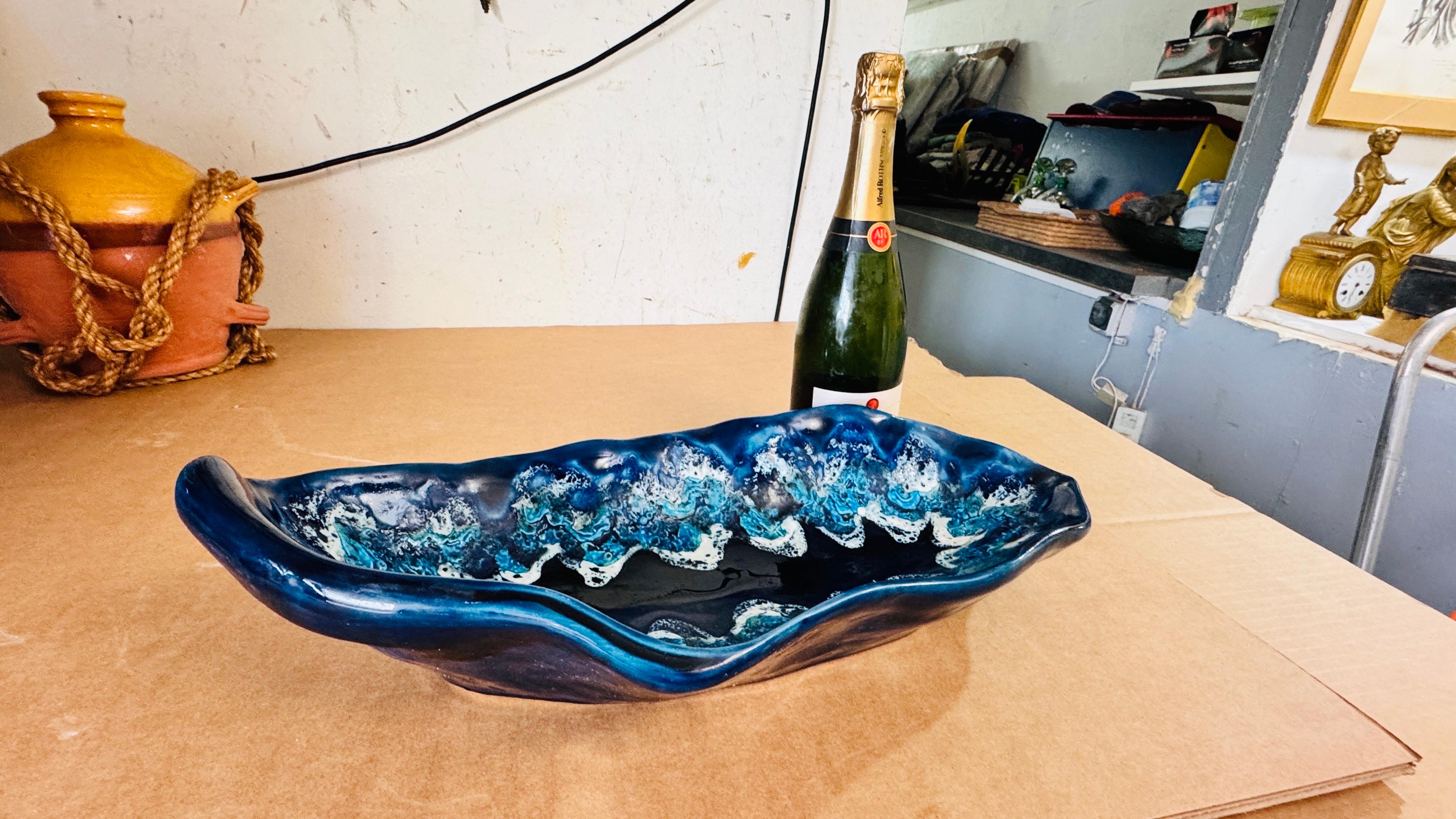 Title: Large Ceramic Centerpiece or Catchall, Vallauris, France, 1960s

Description:
This stunning large ceramic piece, crafted in Vallauris, France, during the 1960s, is a remarkable example of mid-century French artistry. Both functional and