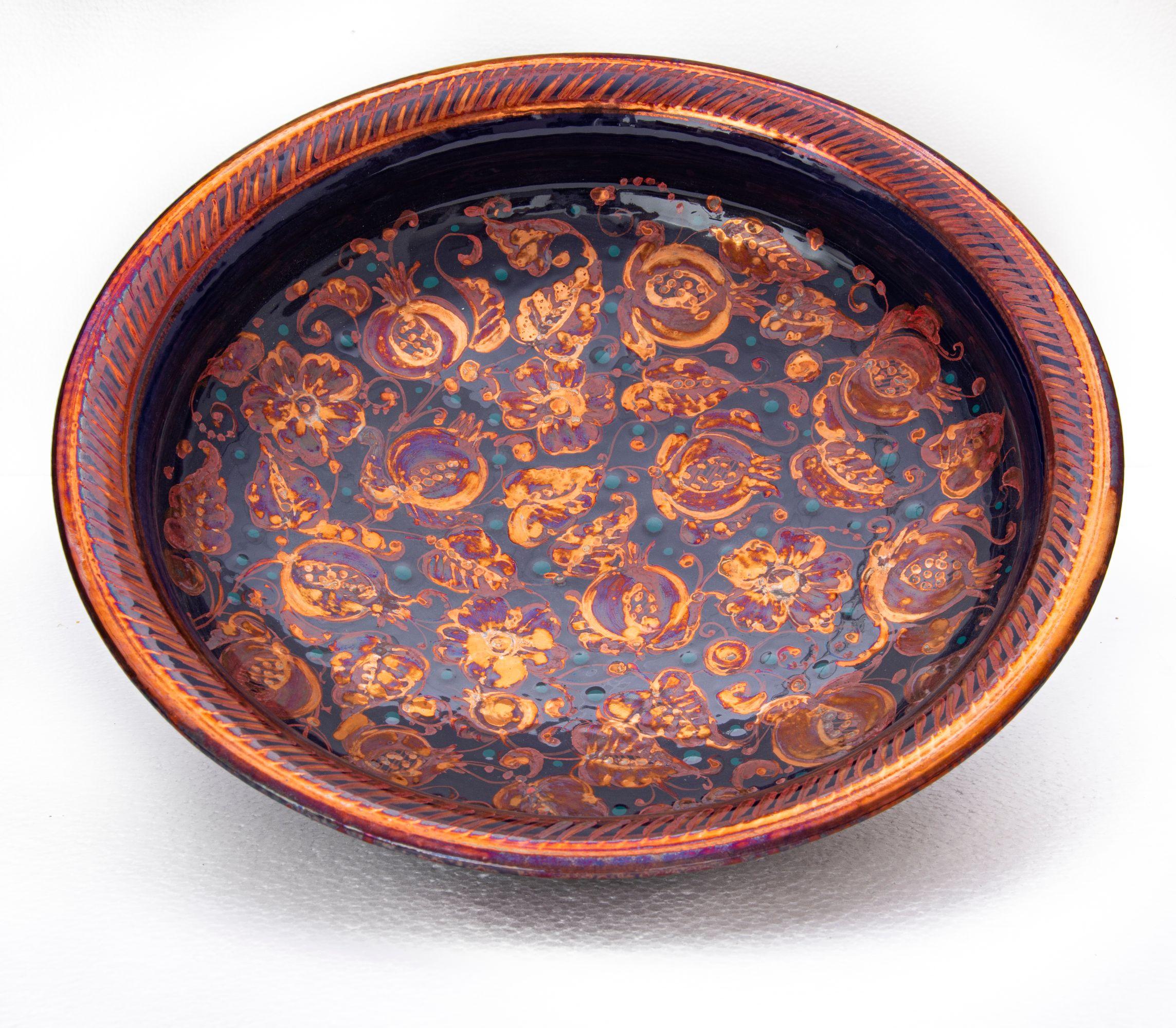 Large bowl with pomegranate decor, full-fire reduction faience earthenware 40 cm diameter, unique piece, 2020

Bottega Vignoli is a brand of artistic ceramics based in Faenza, one of the most representative ceramic production centers in Italy.