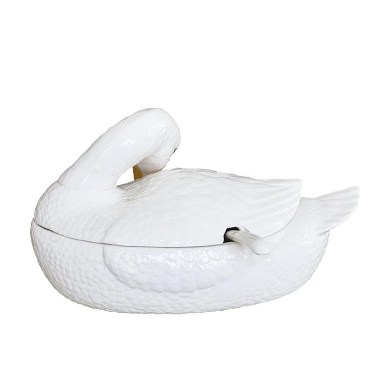 Your next dinner party just got interesting. This large ceramic duck tureen is just what your table has been asking for. Created from ceramic, this piece is shaped like a duck. The top consists of the top of the bird's body which is removable to