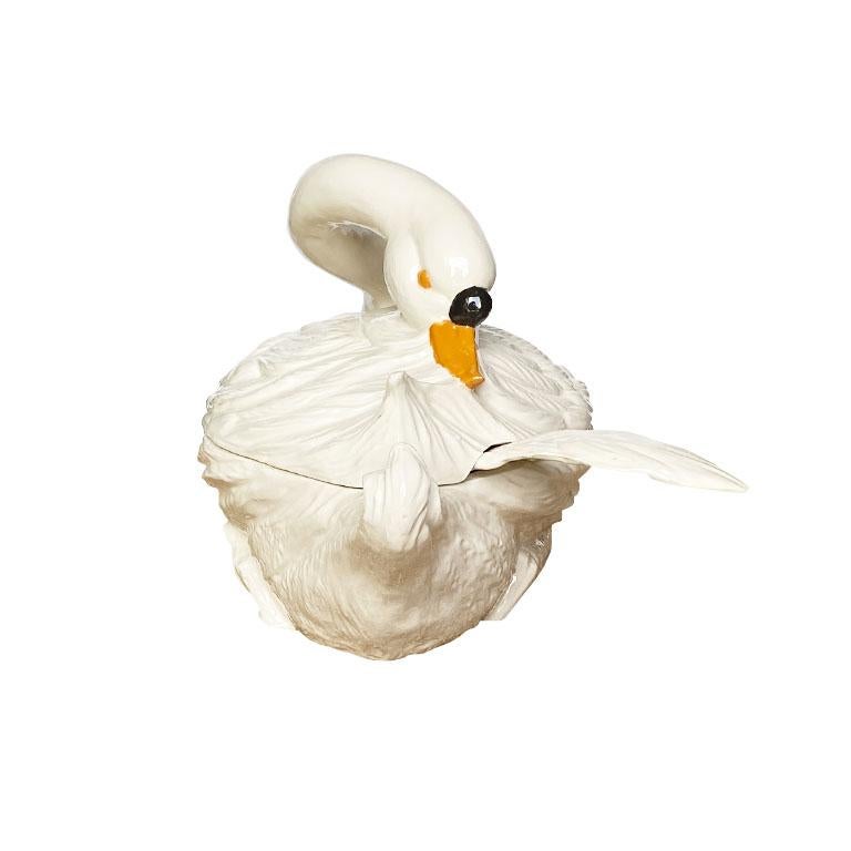 Your next dinner party just got interesting. This large ceramic swan tureen is just what your table has been asking for. Created from ceramic, this piece is shaped like a swan. The top consists of the bird's long white neck which is removable to