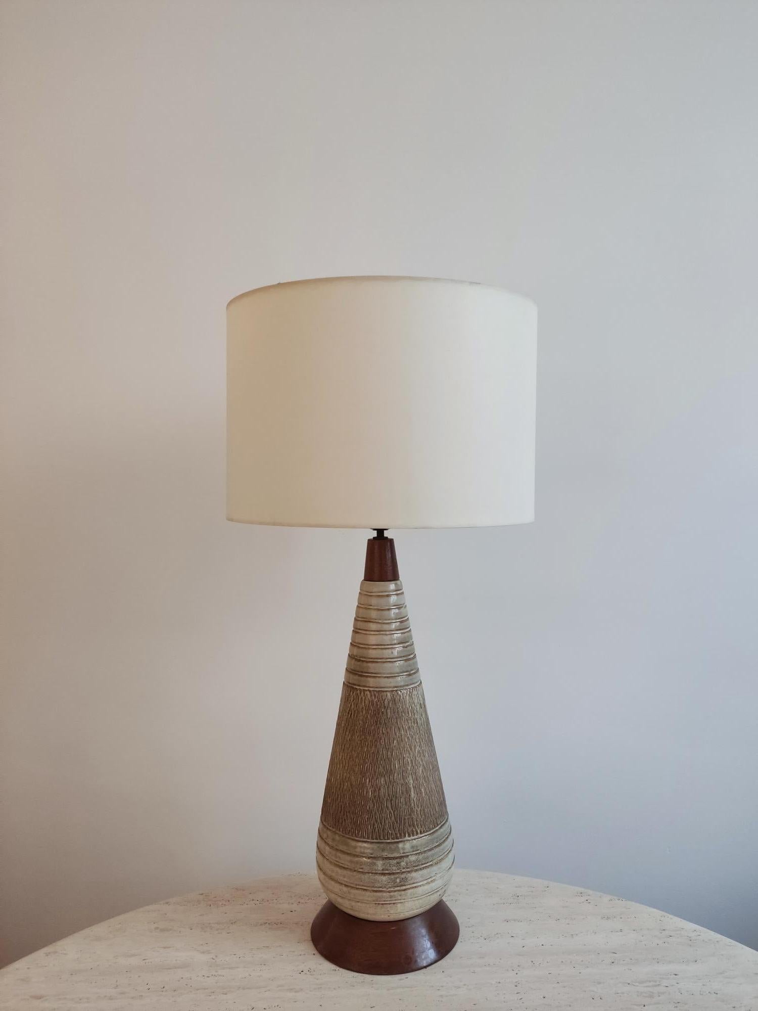 Large mid-century Danish ceramic and wood lamp. Lots of elegance and beautiful proportions for this tall lamp. The sober colors will adapt to all interiors.