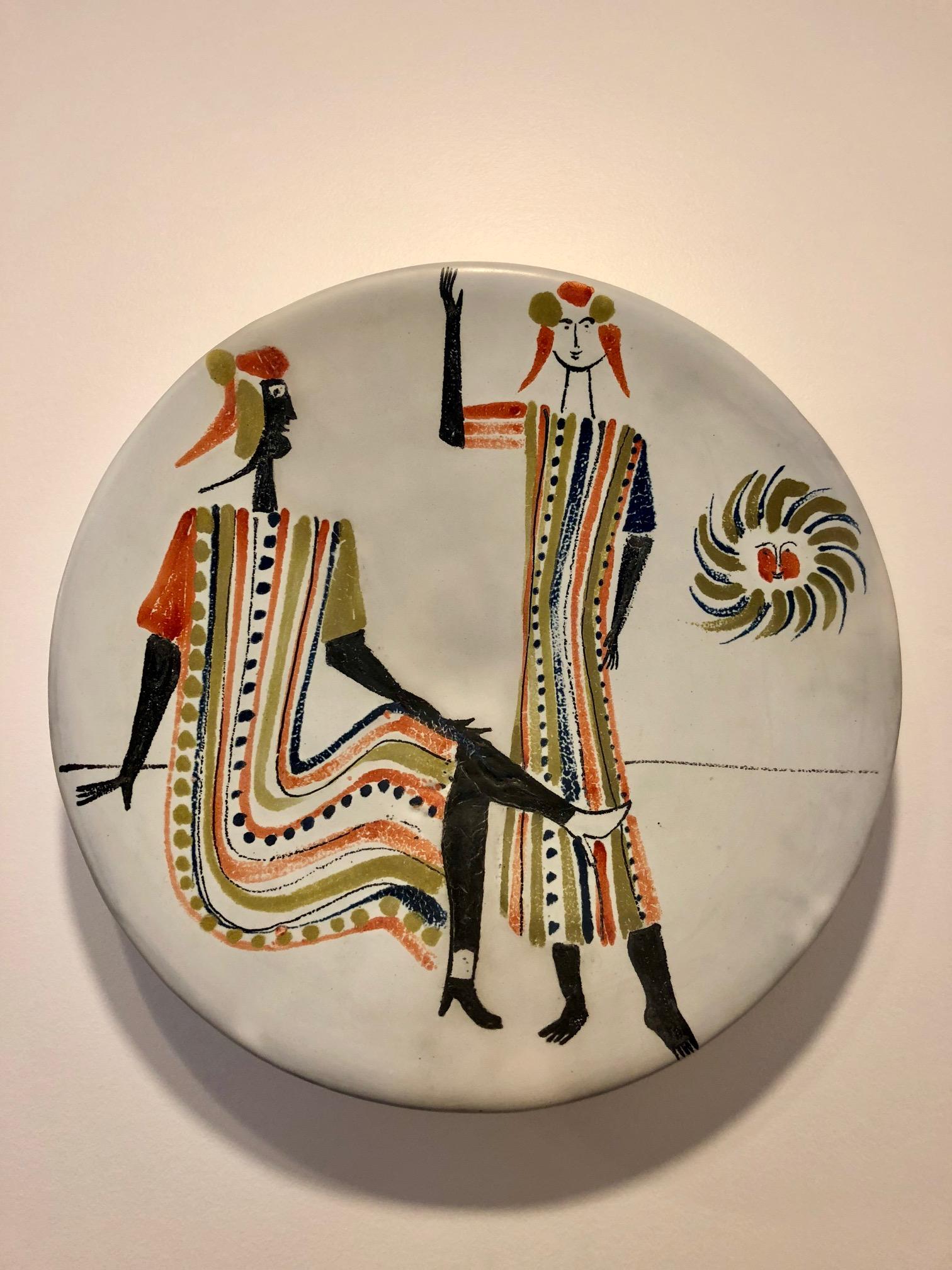 Roger Capron (1922-2006)
Large plate, faience tin glaze, paraffin reserve and polychrome decoration with ancient figures, 1955
Measures: Diameter 39 cm. Signed Capron Vallauris.
