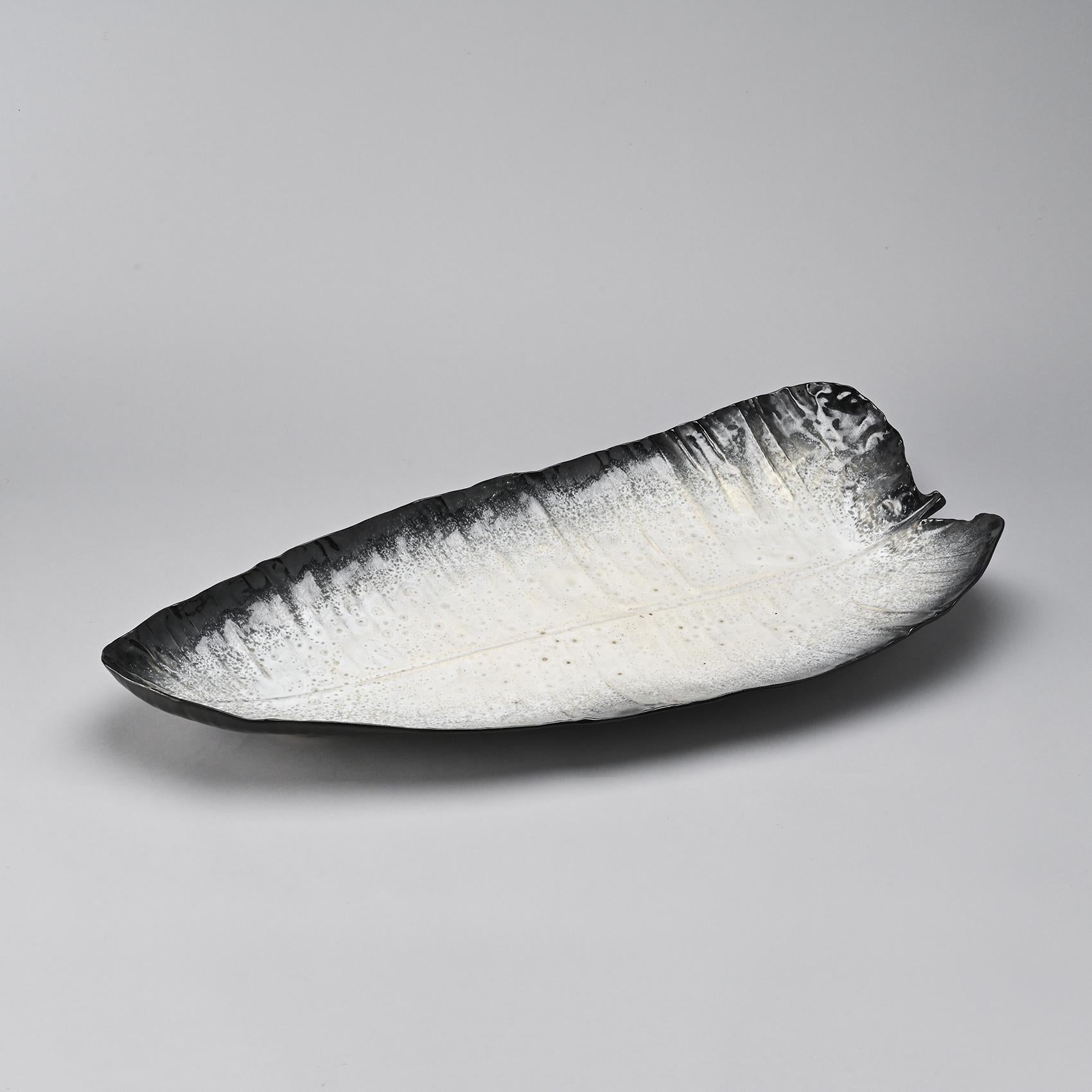 A very large dish by the French ceramist and sculptor Pol Chambost, one of the leading ceramic artists in 20th-century France, whose influence was significant in the 1950s and who subsequently trained numerous talents.

This wide leaf-shaped piece,