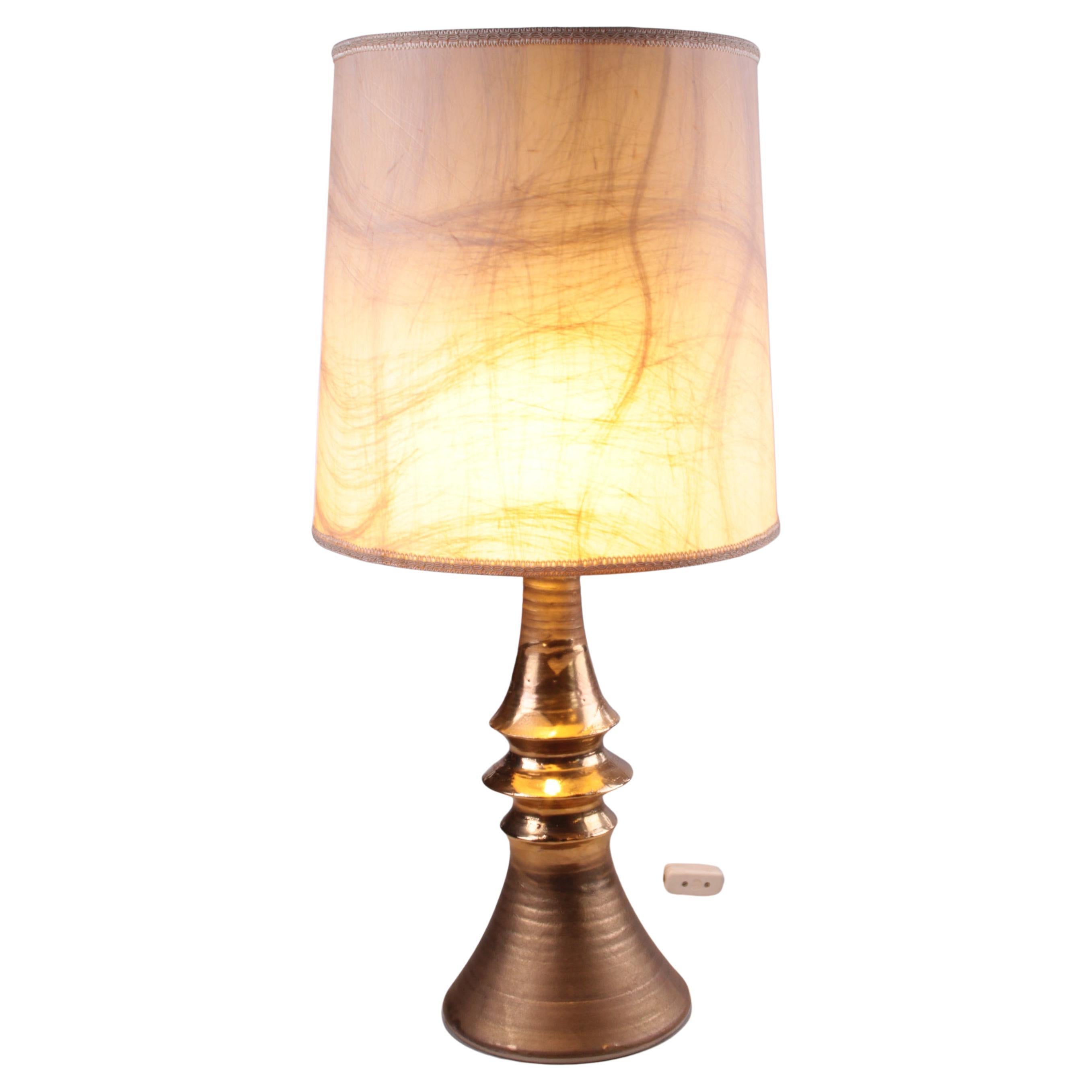 Large ceramic gold table lamp hand turned with original shade from the 1970s For Sale
