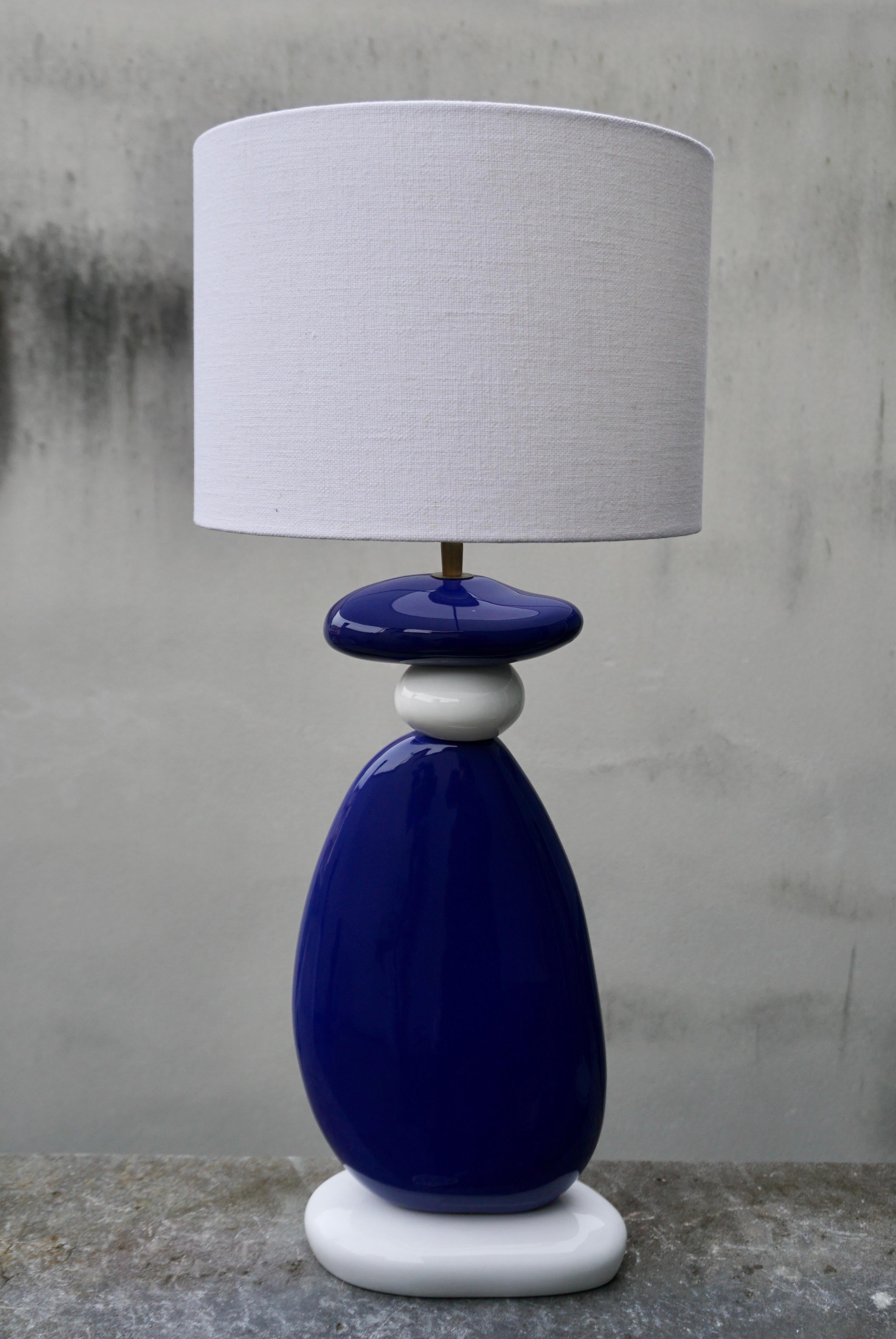 Colorful blue and white French ceramic table lamp with irregularly shaped stacked spheres by Francois Chatain.
France, circa 1970s 
Including shade.