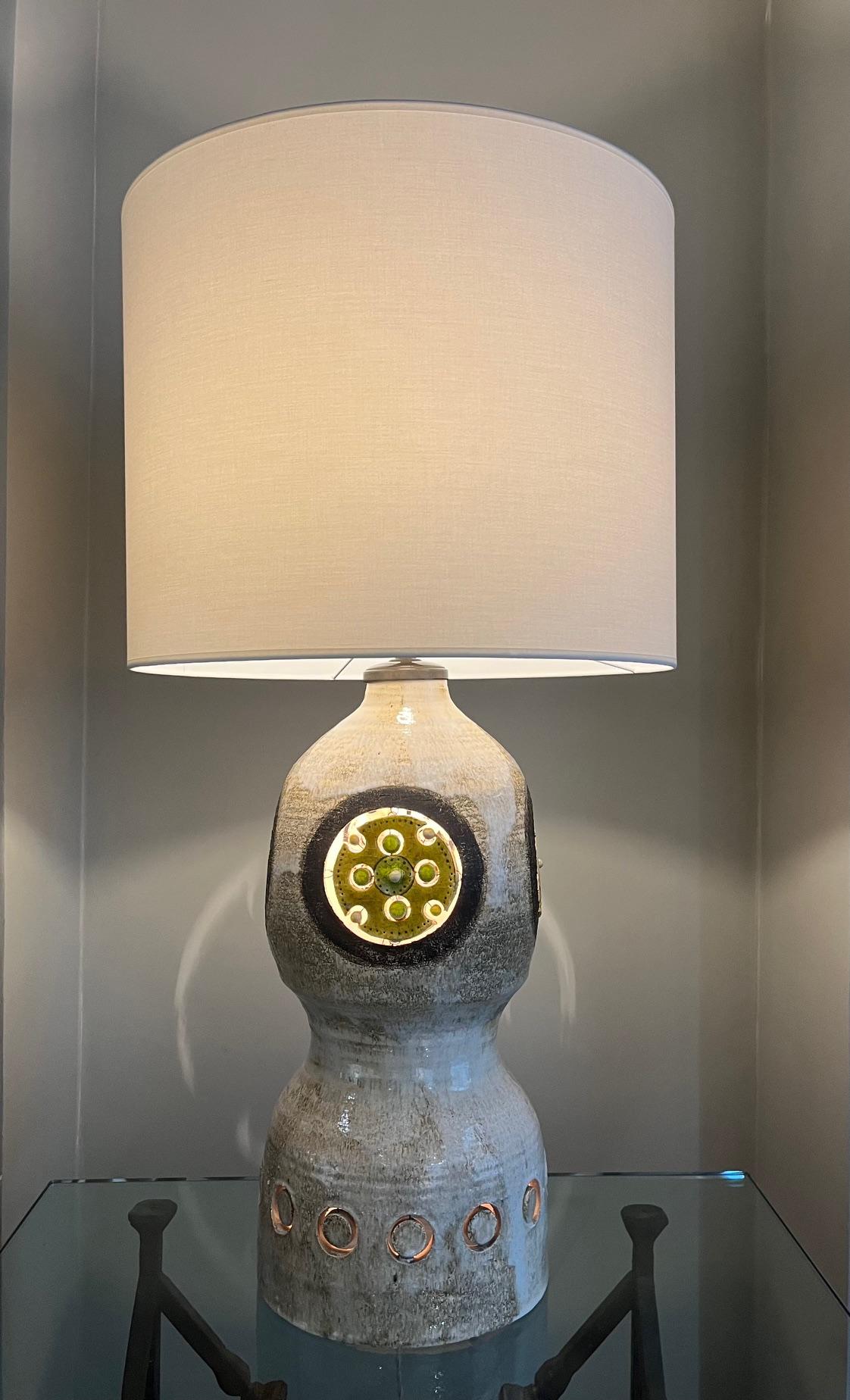  Large ceramic lamp by Georges Pelletier.
Glazed ceramic with openwork on each face in shades of greens
Electrified inside the lamp body.

South of France circa 1970 

 Ceramic Height: 56 cm ( 22 inches)
Total Height: 96 cm ( 37.8  inches ) 
Ceramic