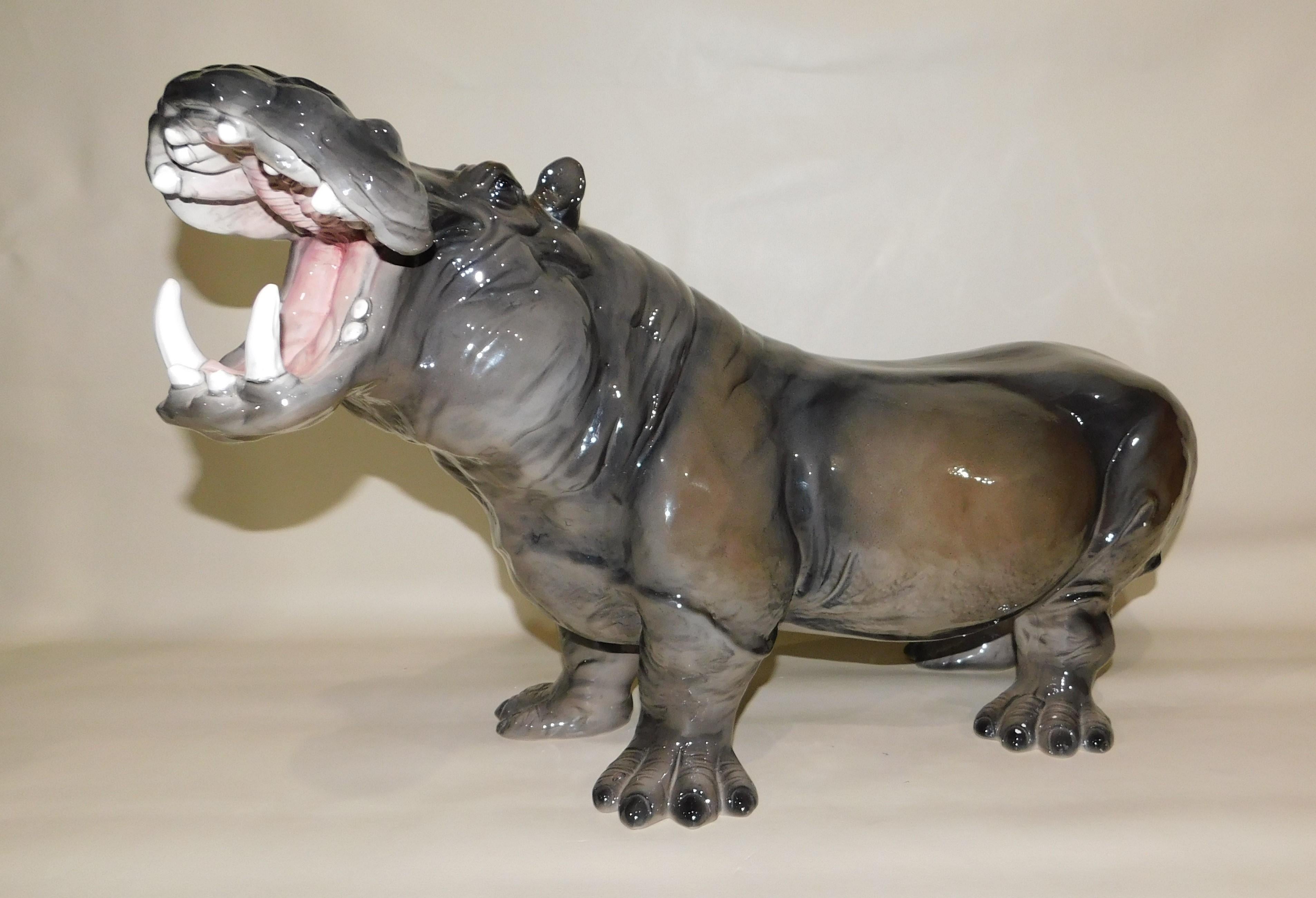 Handmade, painted and glazed in Italy, large Mid-Century Modern ceramic hippopotamus, circa 1960. This rare charming sculpture presents an accurate and detailed depiction of a fierce hippo with it's mouth wide open showing its teeth. Over two feet