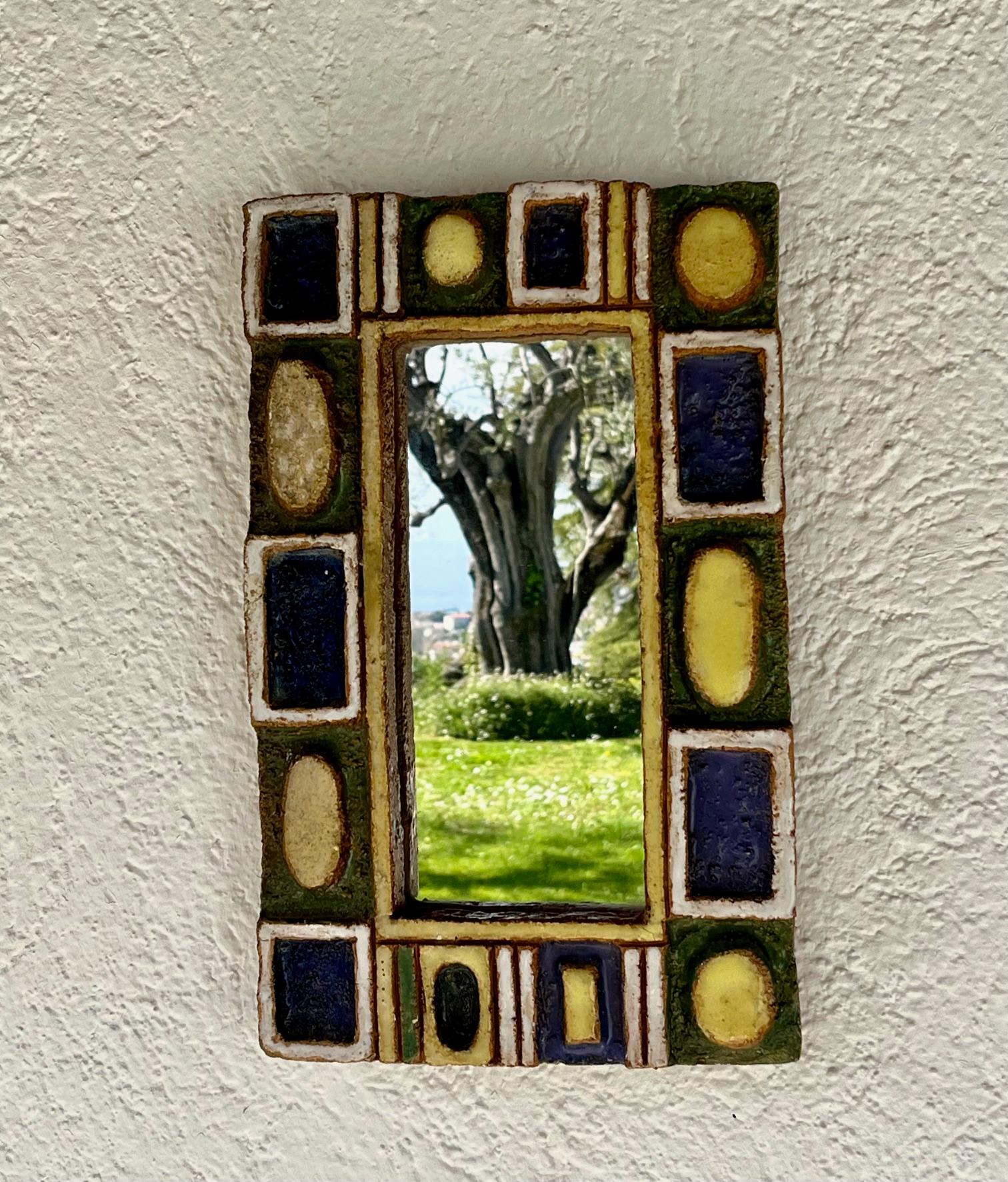 
Large rectangular ceramic mirror.
The  glazed ceramic frame sporting embossed geometrical motives
Les Argonautes (Frédérique Bourguet and Isabelle Ferlay), French workshop
created in Vallauris, south of France, in 1953 and active until the death
