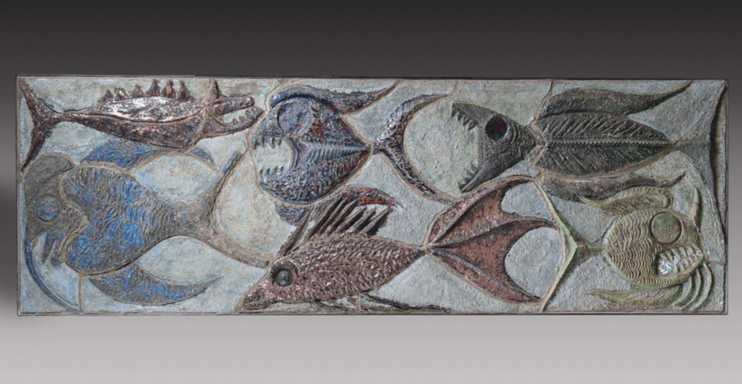Large glazed ceramic decorative panel with fish in relief on a blue background.
Signed and dated 1969 on the reverse. It is supported by a wooden panel and mounted in an original iron frame.