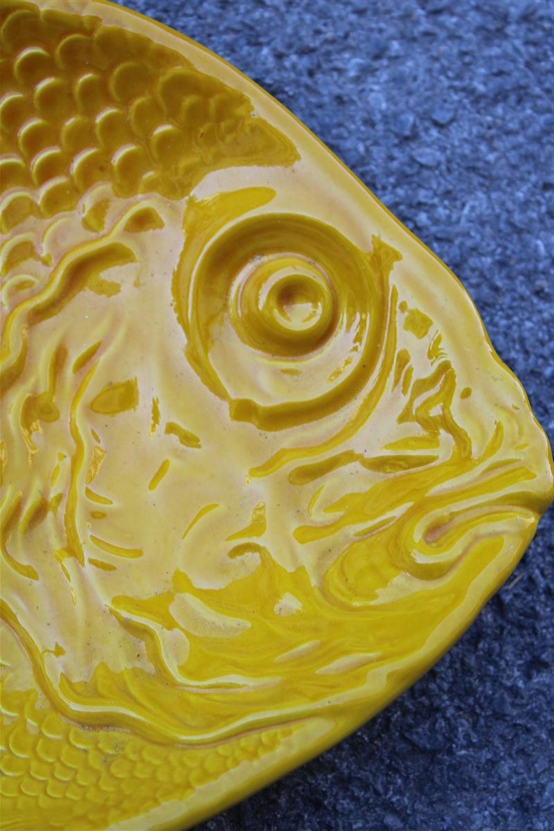 Large ceramic plate in the shape of a yellow fish, Italy, 1970.