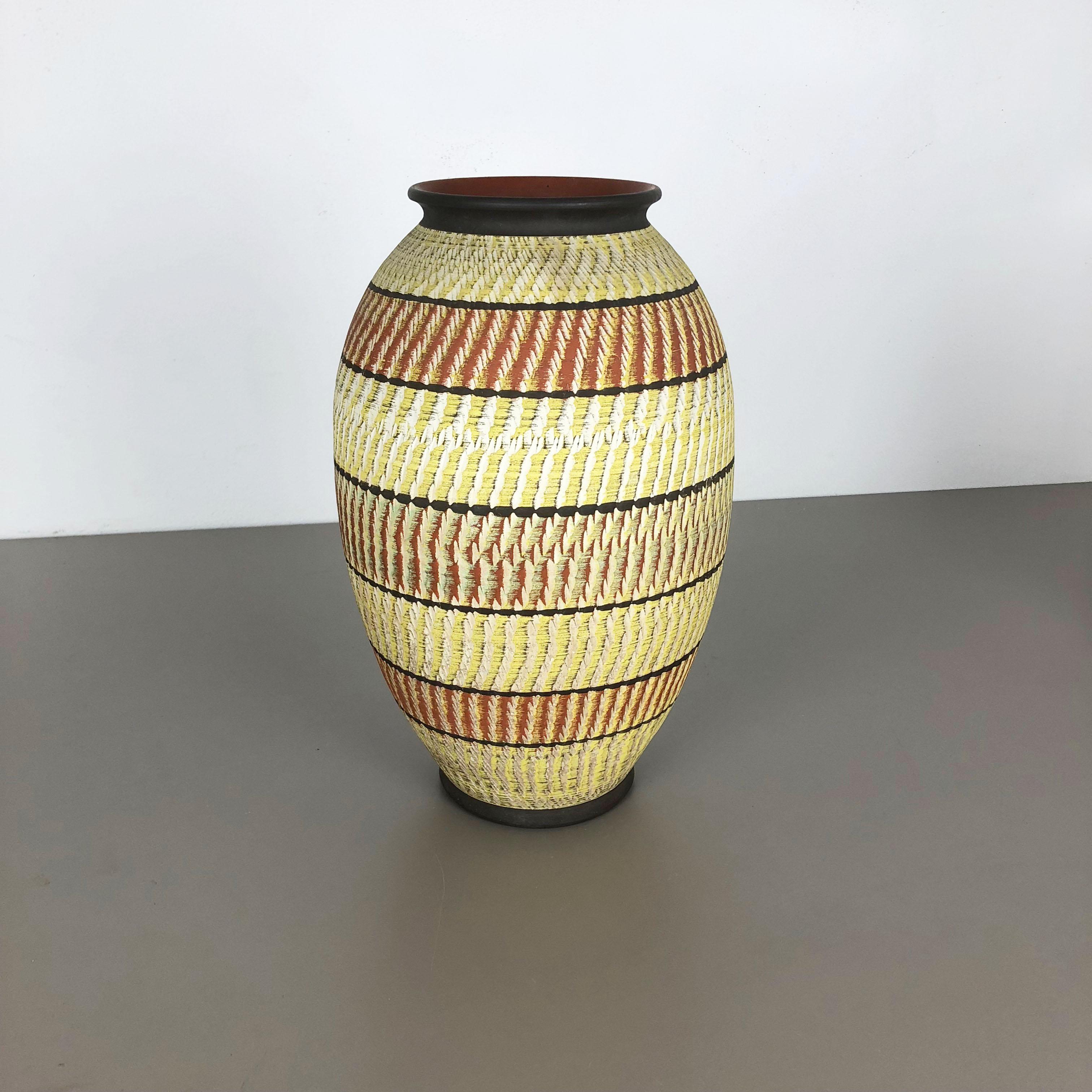 Article:

Pottery ceramic vase


Producer:

Zöller and Born, Germany


Decade:

1950s





Original vintage 1950s pottery stoneware ceramic vase in Germany. High quality German production with a nice abstract coloration. The vase was designed and