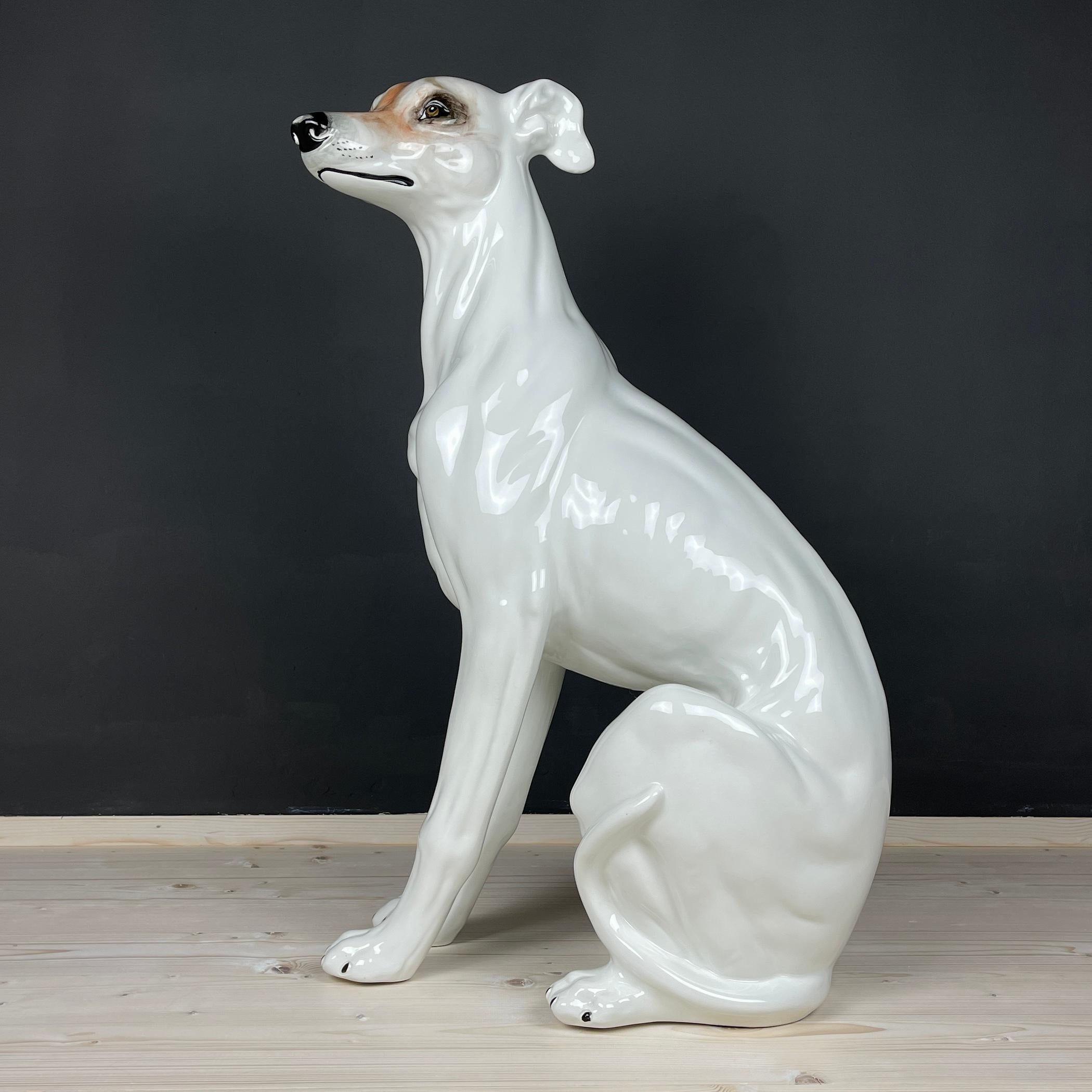 Unveil the allure of Italian craftsmanship with this stunning large hand-painted ceramic animal sculpture – a dog, a treasure from 1980s Bassano, Italy. Immerse yourself in the rarity of this piece, a hand-painted ceramic sculpture that stands as a