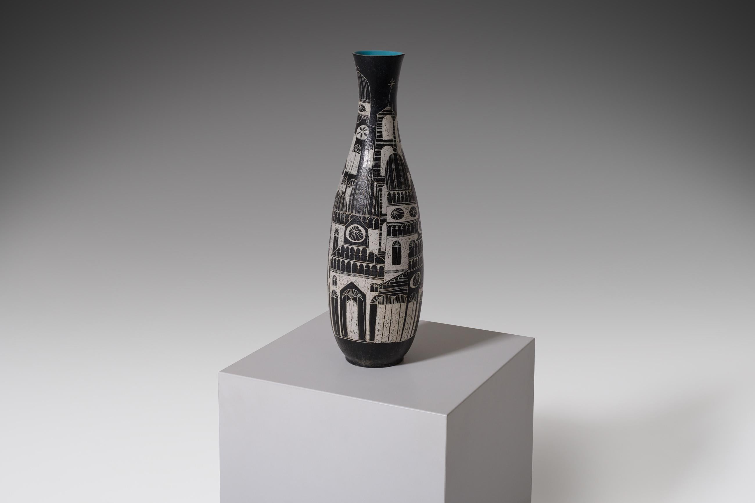 Large decorative ceramic vase by master ceramist Marcello Fantoni, Italy, 1950s. The vase shows a drawing of several women on one side and a variation of buildings on the other. A very nice and decorative scene done in black and white. The inside is