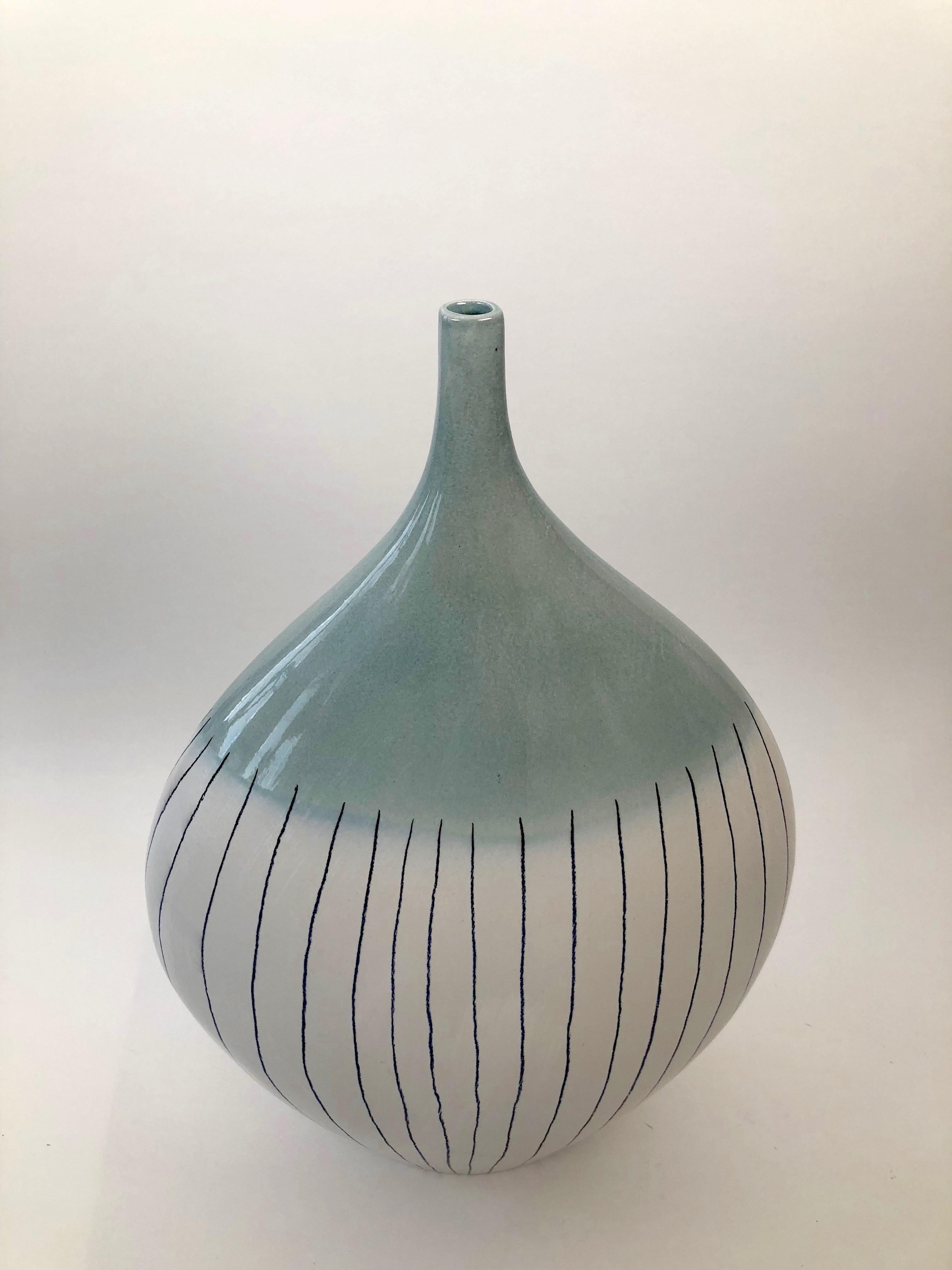 Large ceramic vase, made in Czechoslovakia about 1965. Organic form with a contrast of glazes in aqua and mat white.
Unusual in this size.




 