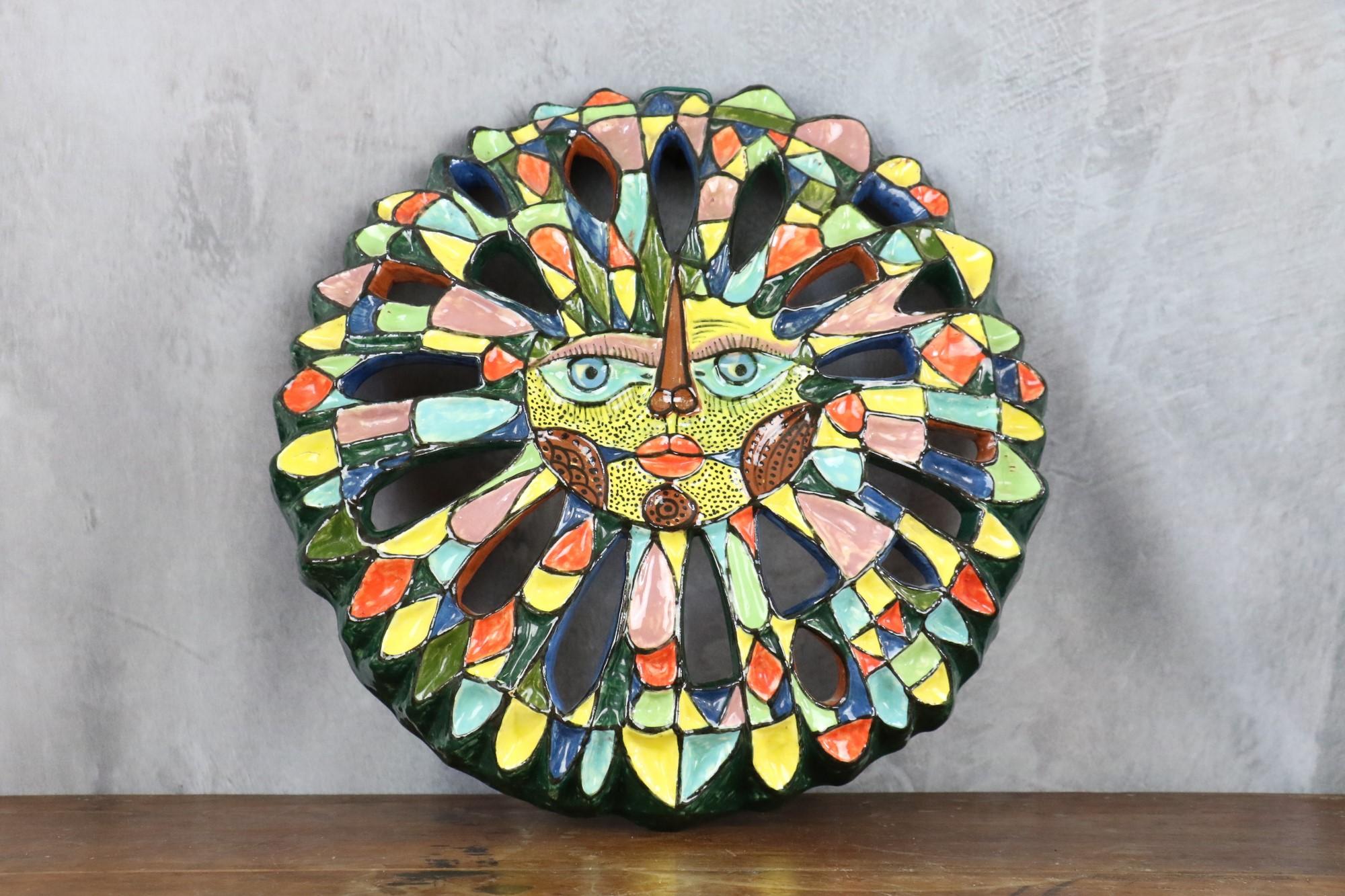 Large ceramic wall sculpture with sun design, Circa 1970s

Superb ceramic sculpture attributed to Roland Zobel. The large sculpture, with its brightly colored glazes, is a magnificent piece. A real eye-catcher. It recalls the creations of the 50s in
