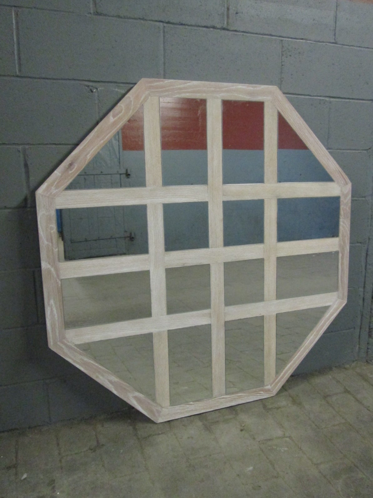 Large cerused oak octagonal mirror. Mirrors are in shapes of squares, rectangles and triangles.