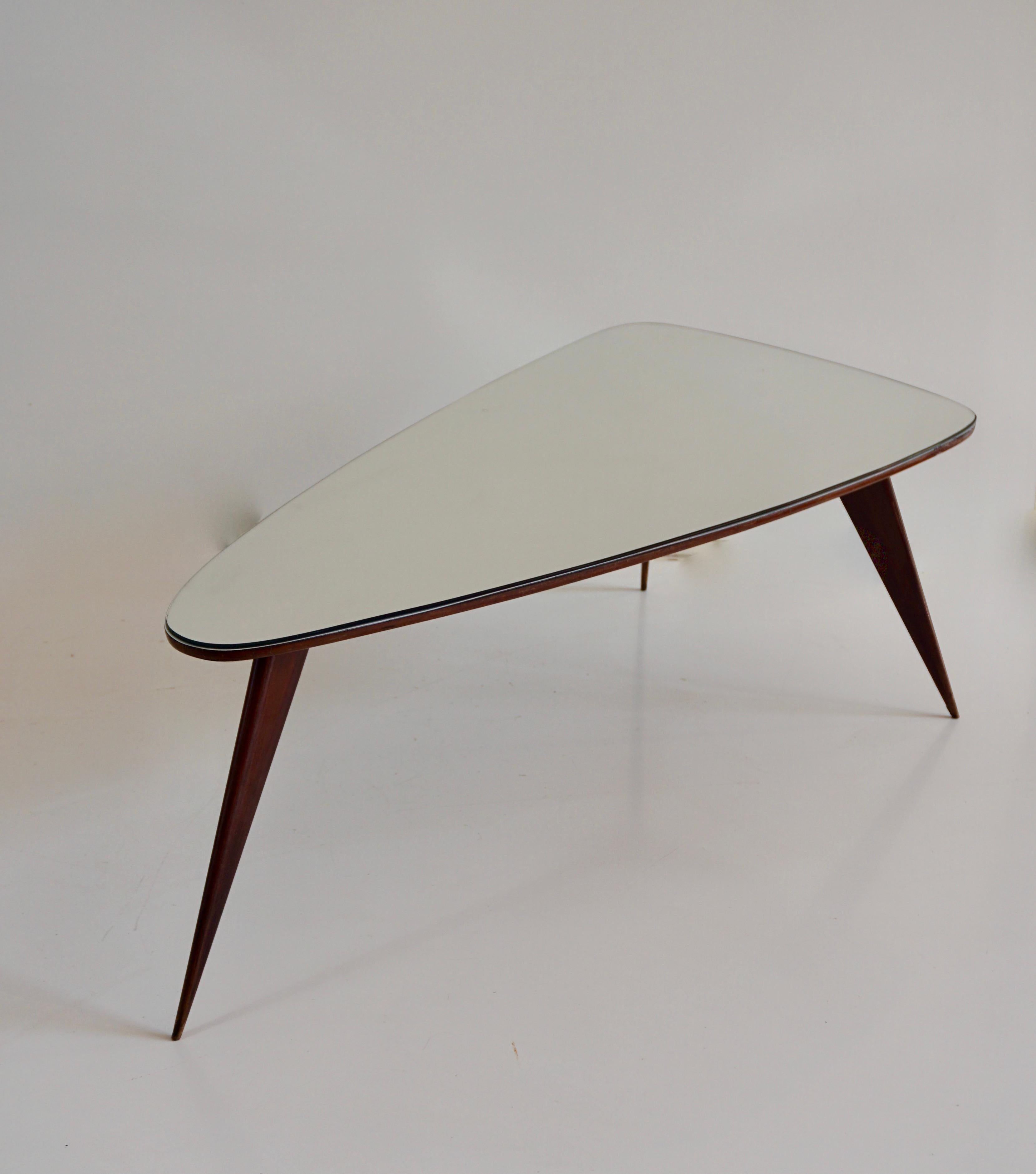 Mid-Century Modern large Cesare Lacca walnut coffee table, three feet irregular shape, mirrored top For Sale