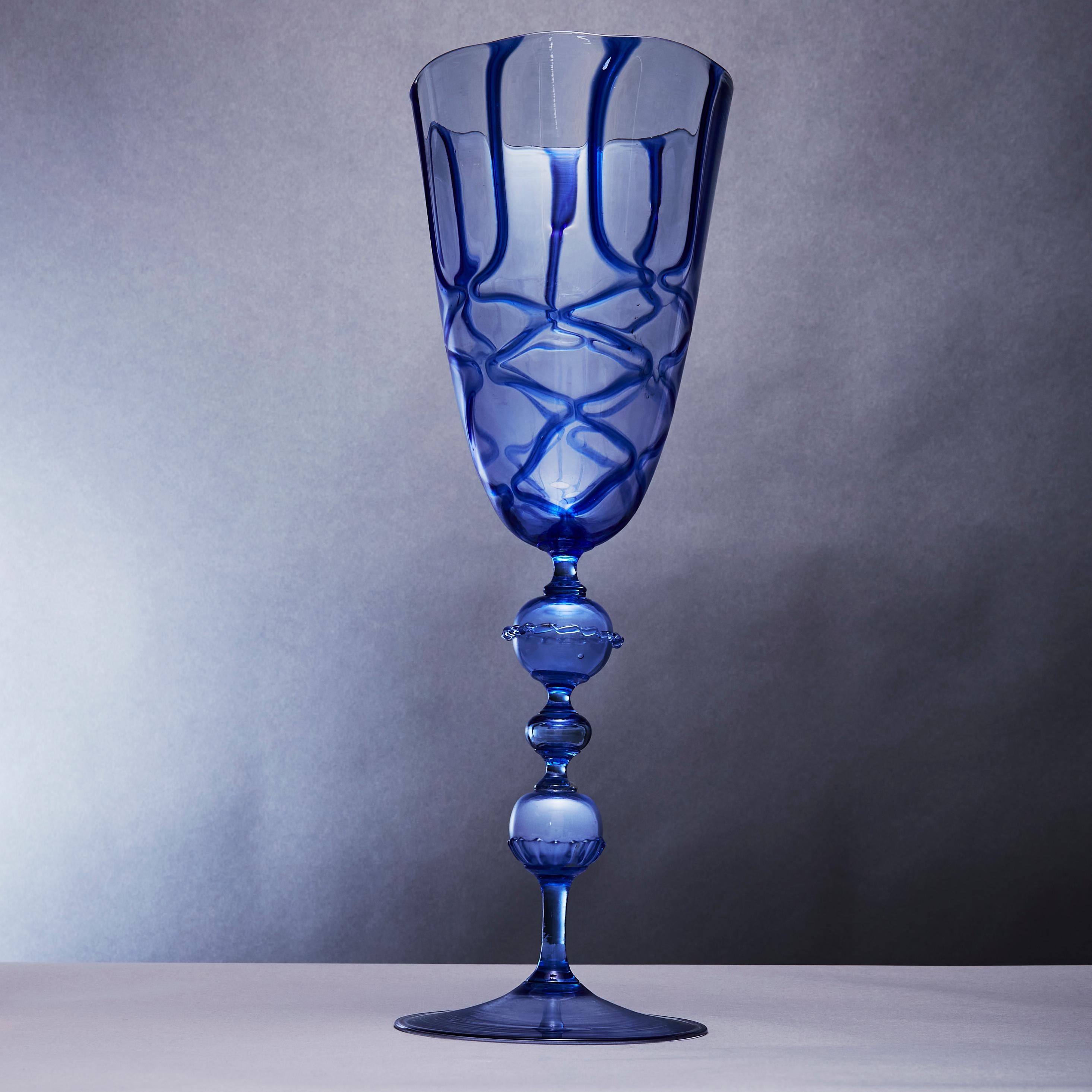 Large Chalice sapphire clear blue applied pattern on translucent blown glass attributed to Artistica Barovier (1919-1936) circa 1920. This goblet sits on a long stem with two decorated glass balls and a small central glass ball resting on a splayed