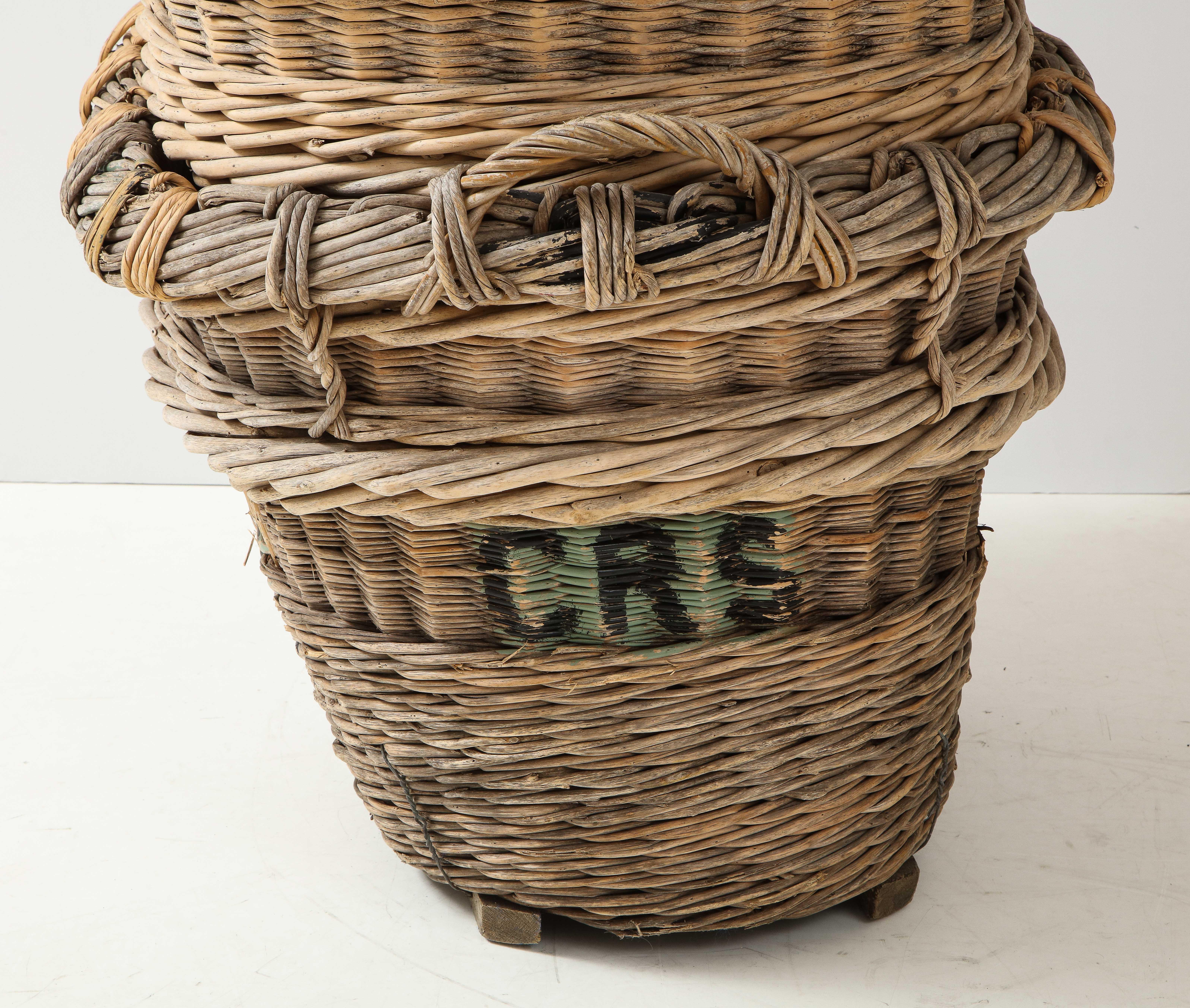 Only 2 left - sold individually

Large Champagne grape harvest baskets, Reims, France, c. 1920-30

These are great for firewood, pool towels, laundry, and just about anywhere you need a beautiful generous collect-all to hide mess. Perfect for