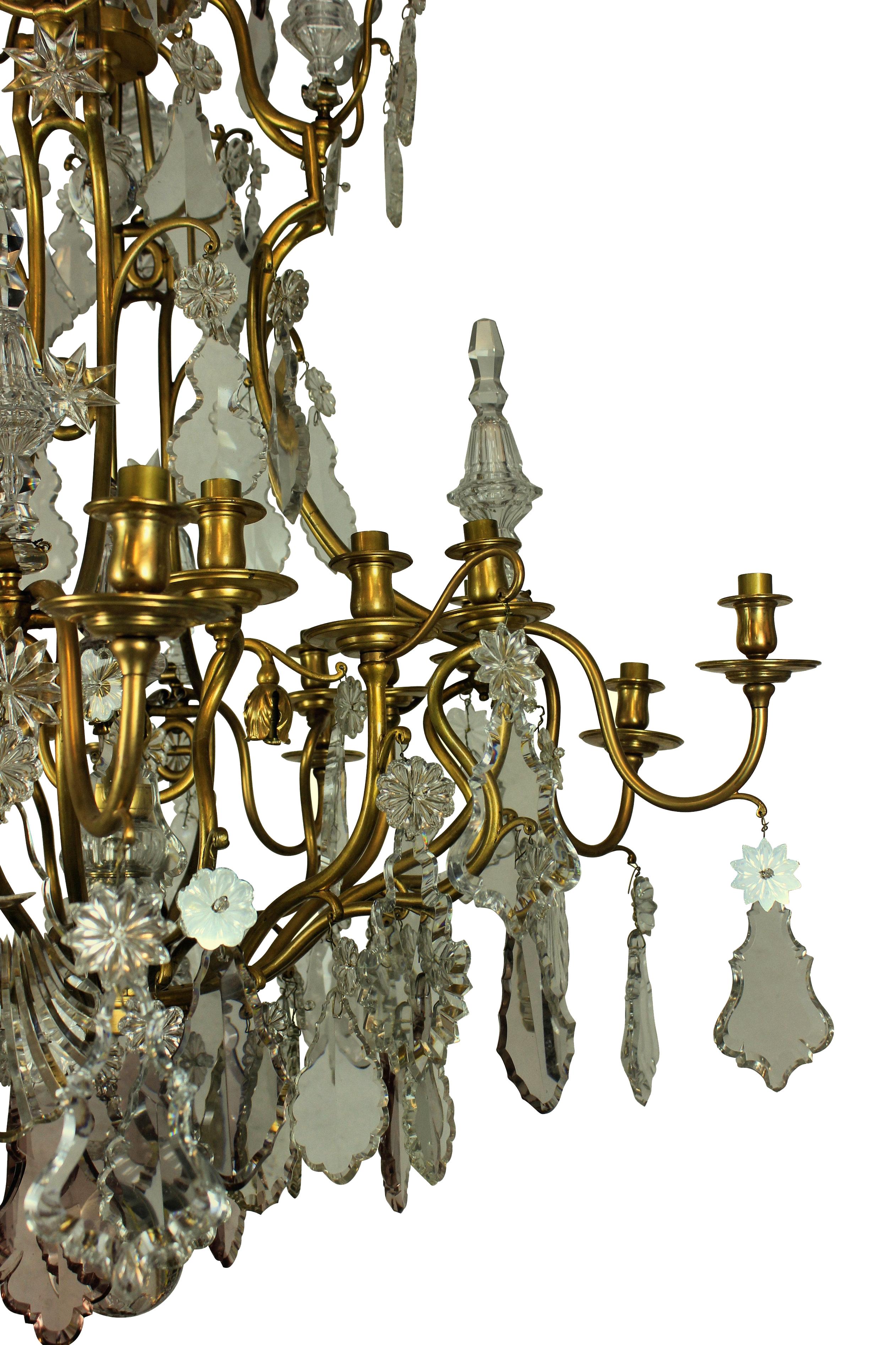 A large ormolu and cut-glass cage chandelier by Baccarat of Paris, en suite with a pair of large wall sconces.
 
 