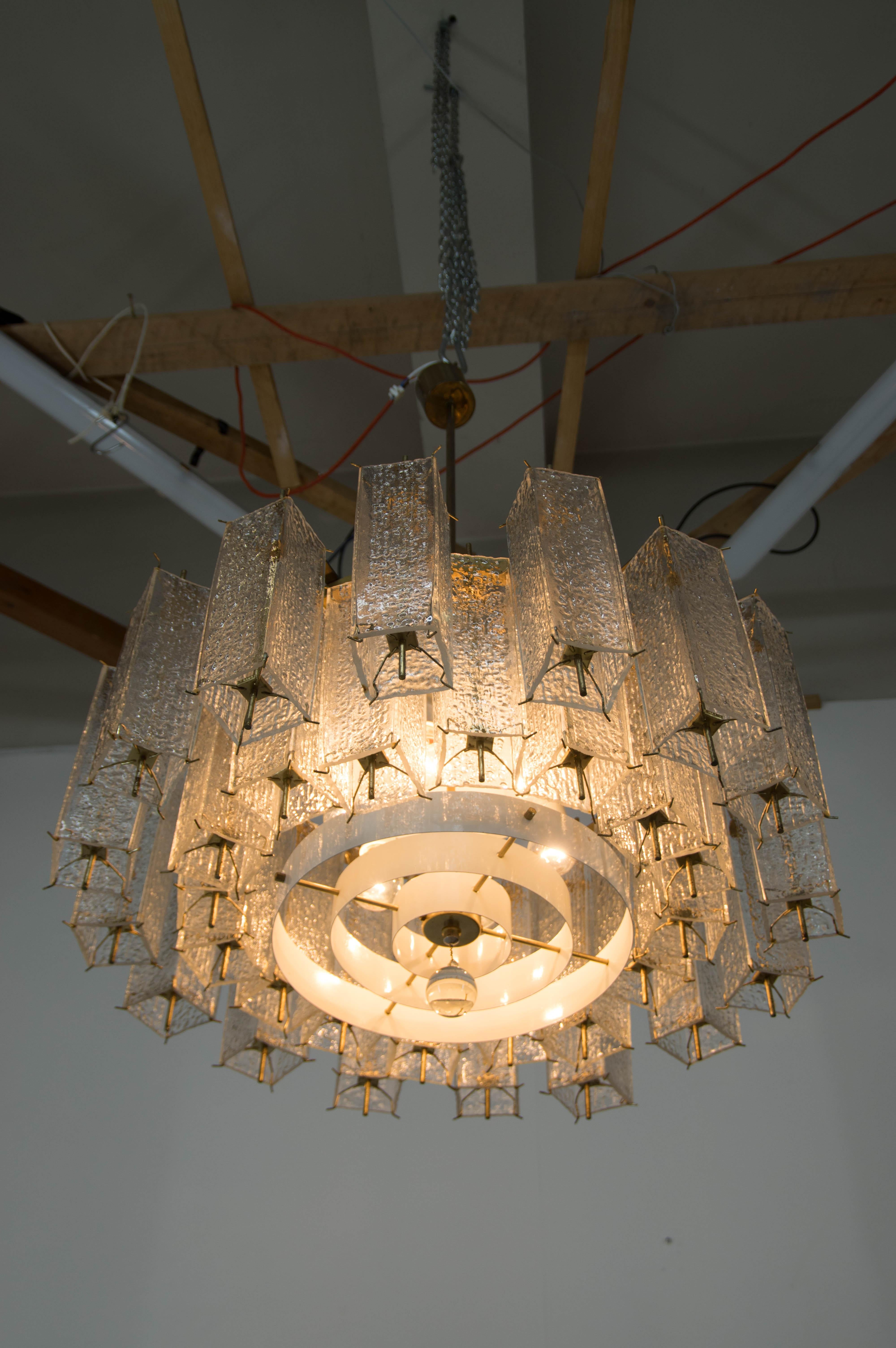 Large and heavy brutalist chandelier by Kamenicky Senov
Three pieces available
Cleaned, rewired: two separate circuits - 3+3x60W, E25-E27 bulbs
Glass in perfect condition
Brass and white lacquered metal with age patina
US wiring compatible.