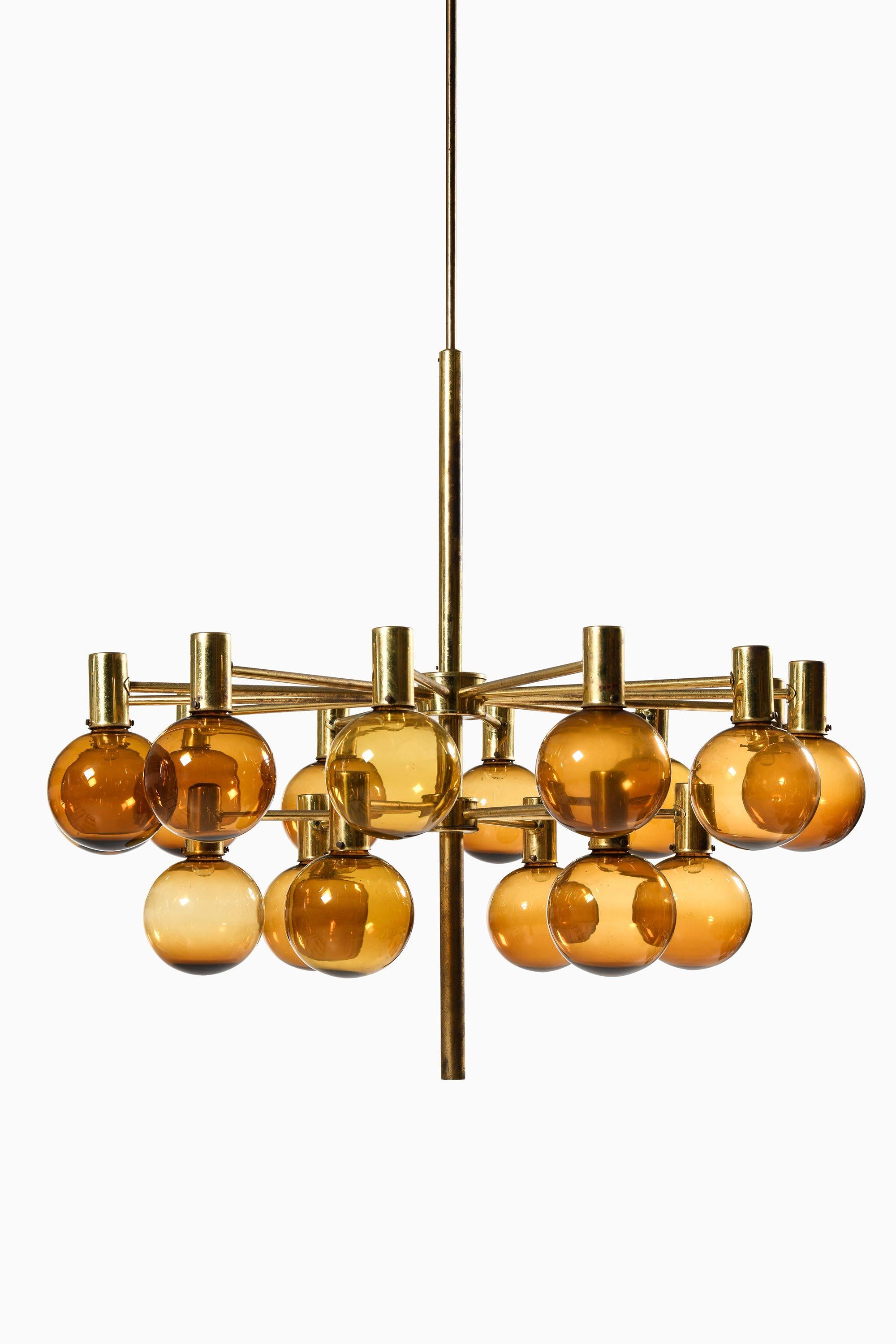 Large Ceiling Lamp in Brass and Amber Glass by Hans-Agne Jakobsson, 1950's

Additional Information:
Material: Brass and amber glass
Style: Mid century, Scandinavian
Produced by Hans-Agne Jakobsson AB in Markaryd, Sweden
Dimensions (W x D x H): 105 x