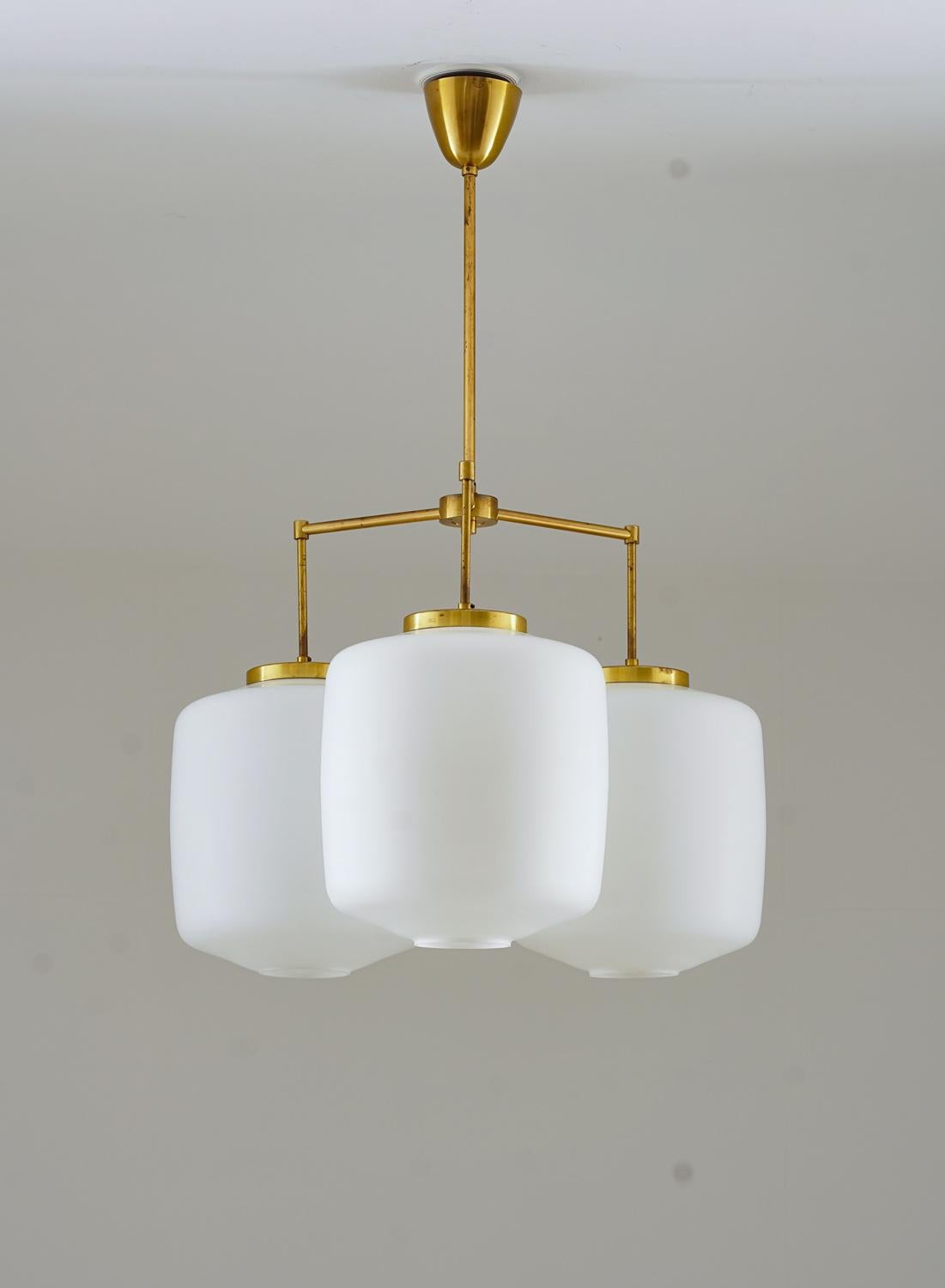 Rare chandelier by Høvik lys, Norway.
This chandelier consists of large opaline glas shades, supported by brass rods that are connected in the center.

Each shade measures 30x33cm (11,8