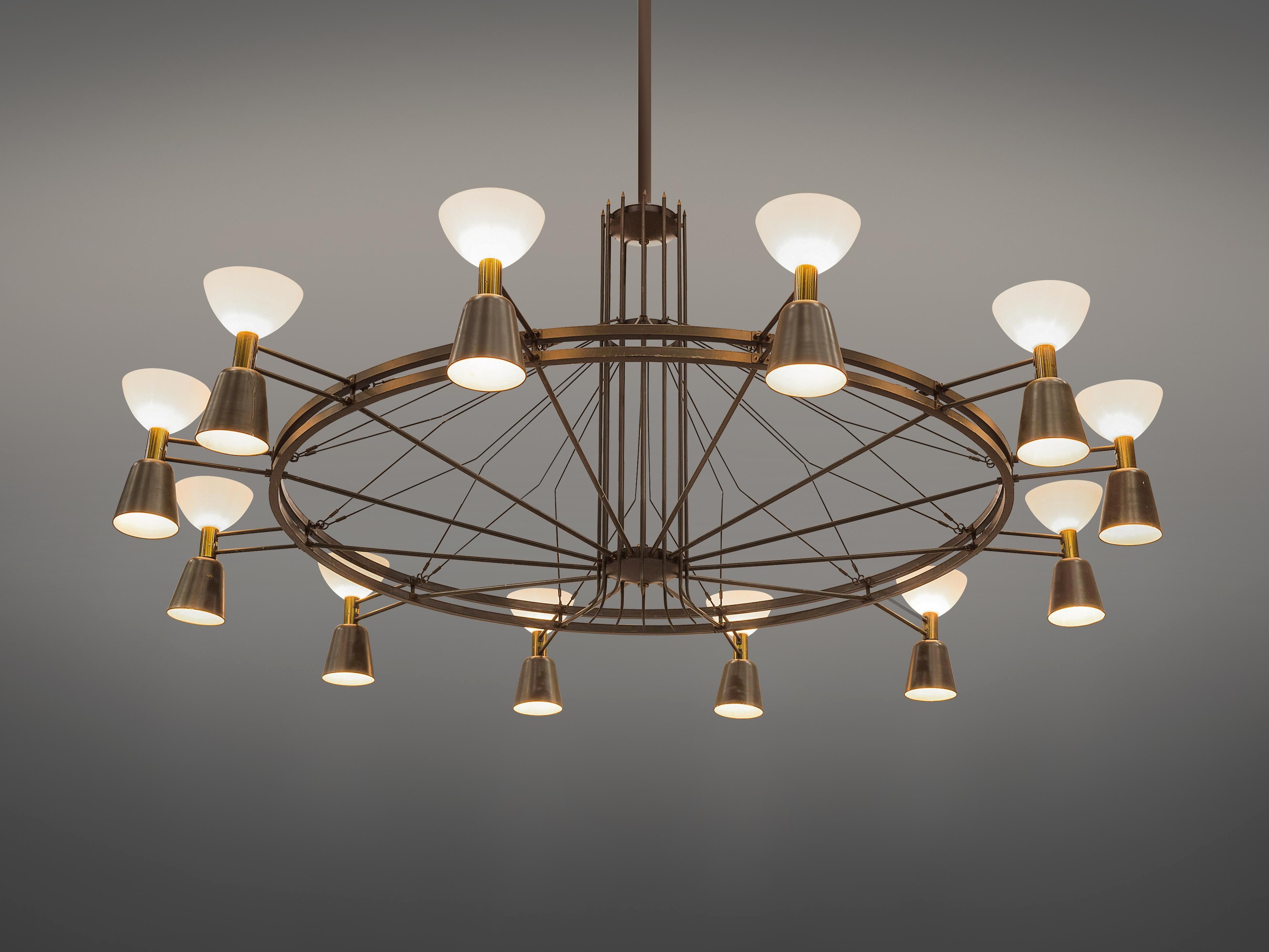 Large chandelier, metal, brass, opaline glass, The Netherlands, 1950s, measure: 14 ft.

This round Dutch chandelier was made in the 1950s. This piece features twelve shades that shine both upwards and downwards, secured to a large circular central