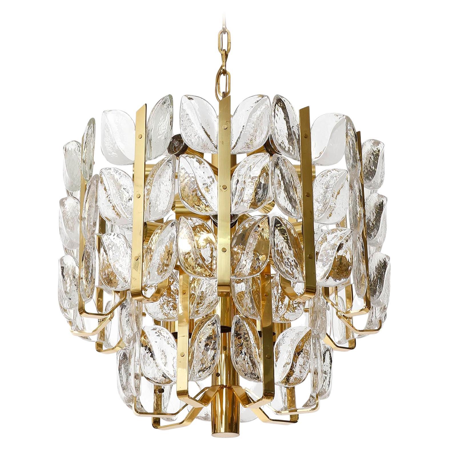 A large, fantastic, beautiful and high quality pendant light fixture model 'Florida' by J.T. Kalmar, Austria, manufactured in midcentury, circa 1970 (late 1960s or early 1970s).
The fixture is made of solid polished brass which has an aged surface
