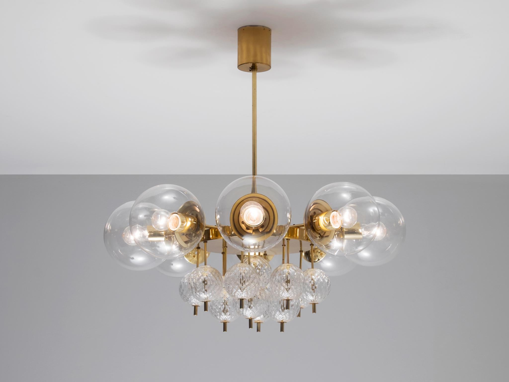 Large brass chandelier with beautiful glass bulbs, 1960s. 

This lights were found in the very south of the Czech Republic, so most likely from Austrian production seen their excellent quality with which they have been manufactured. Eight large