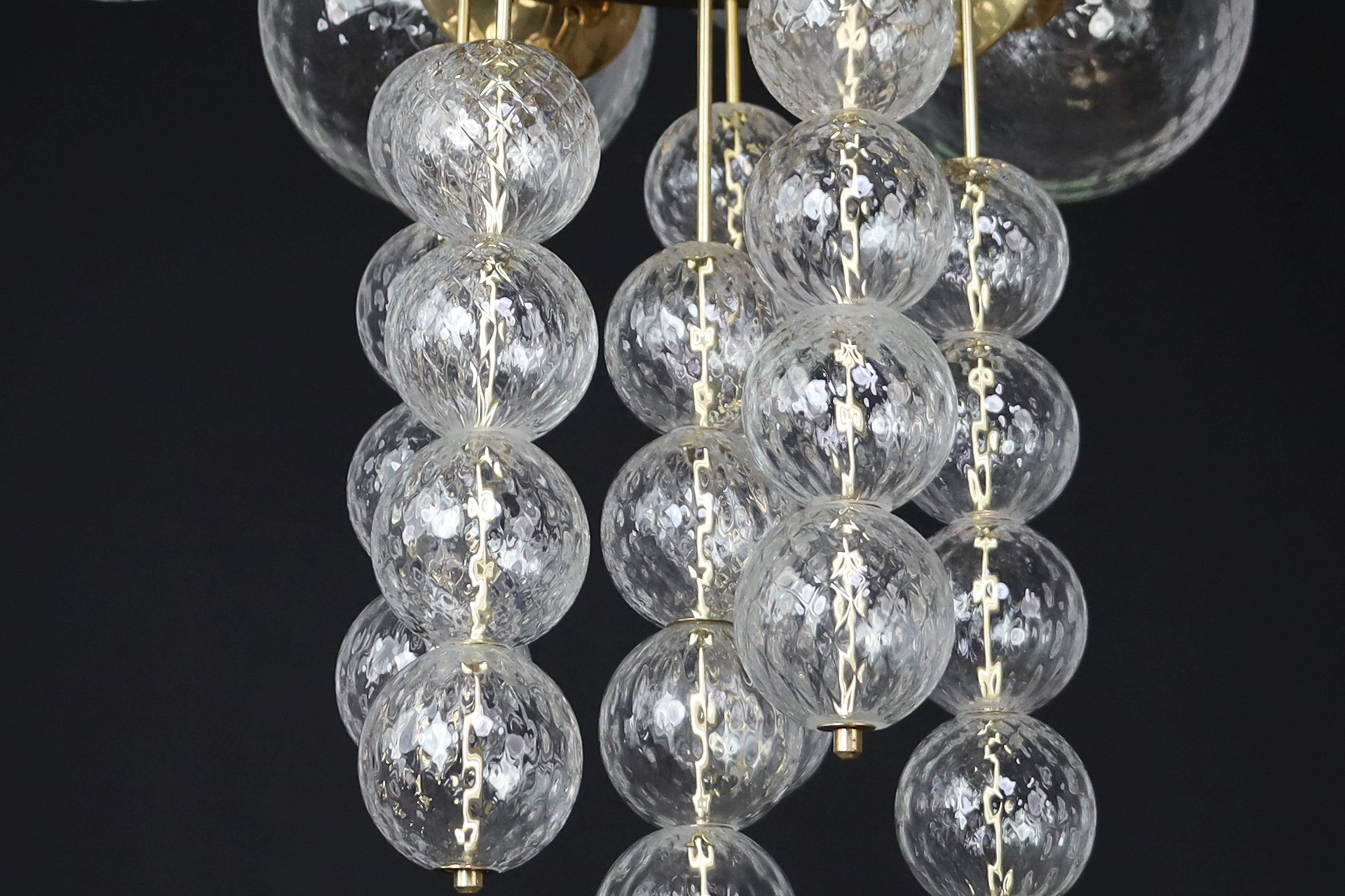 Large Chandelier with brass fixture and hand-blowed glass globes by Preciosa Cz. For Sale 10