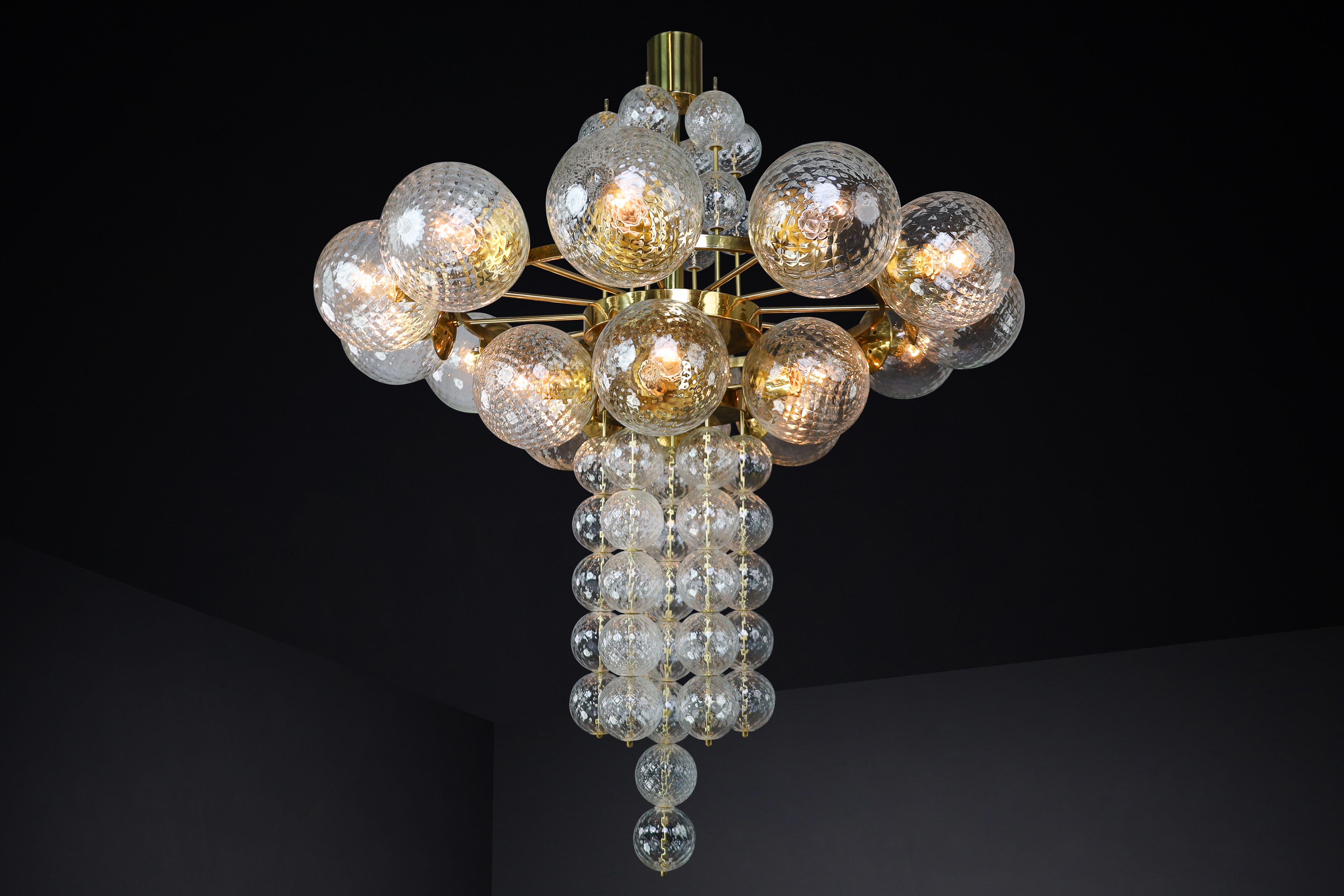Mid-Century Modern Large Chandelier with brass fixture and hand-blowed glass globes by Preciosa Cz. For Sale