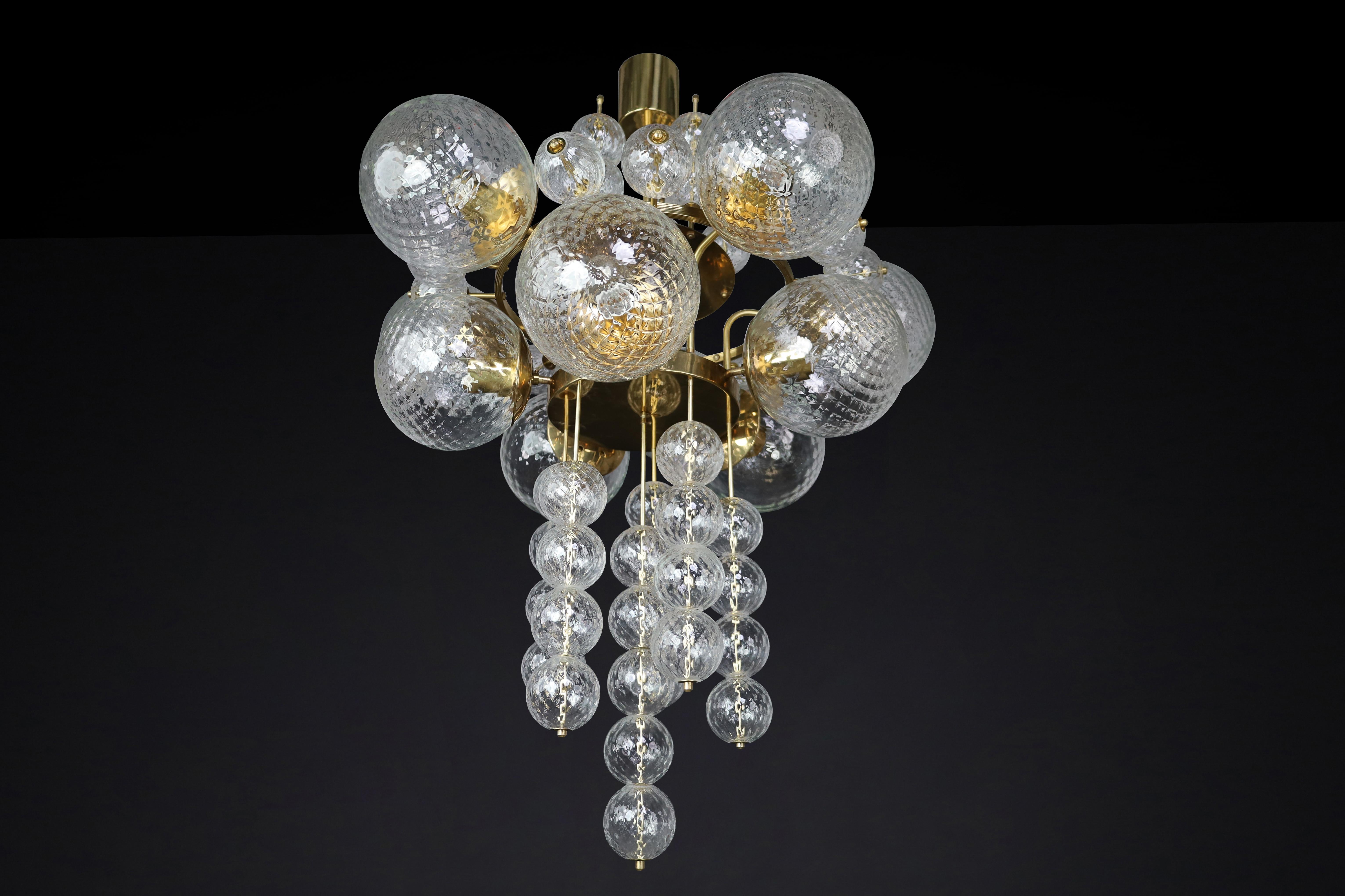 Mid-Century Modern Large Chandelier with brass fixture and hand-blowed glass globes by Preciosa Cz. For Sale