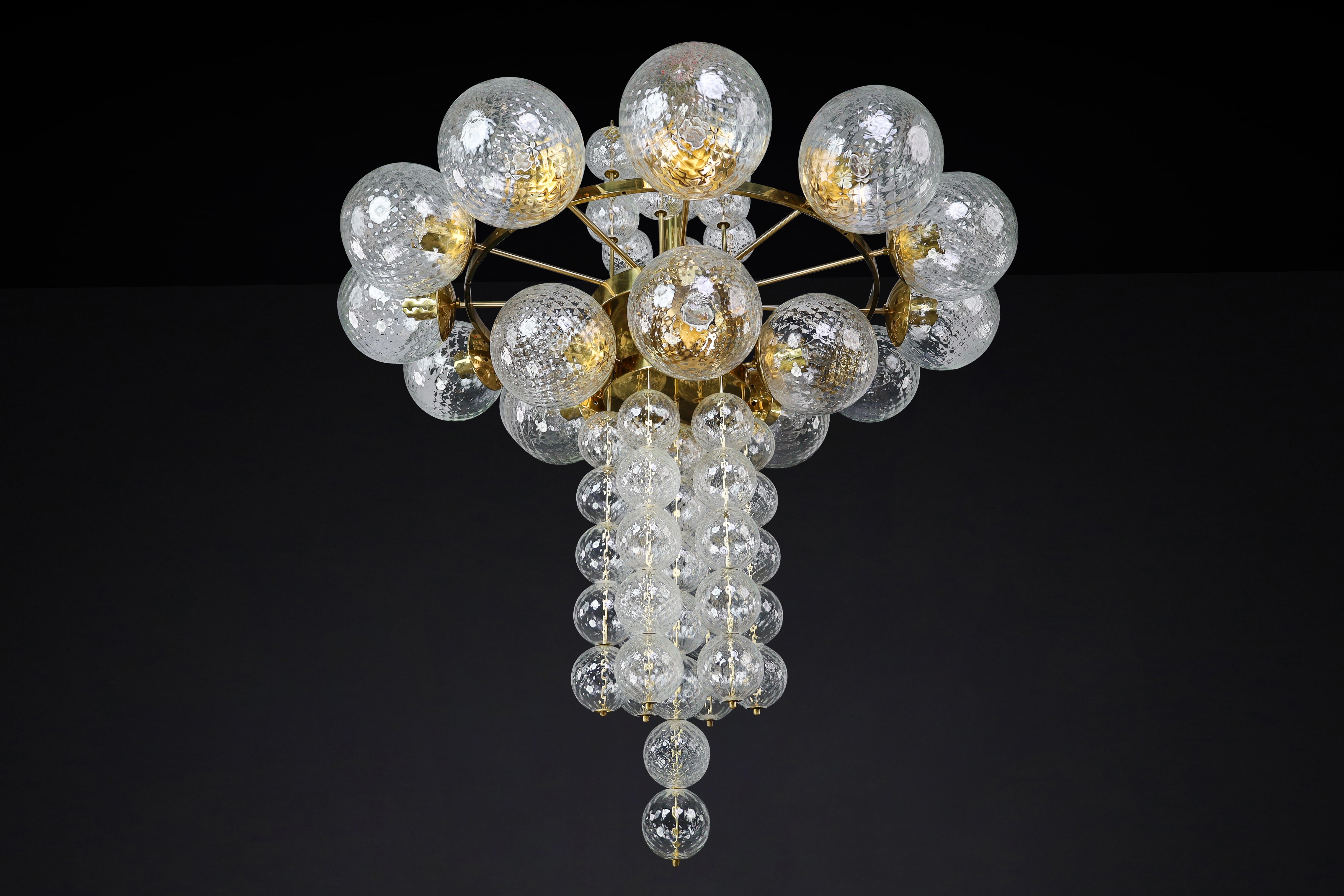 Large Chandelier with brass fixture and hand-blowed glass globes by Preciosa Cz. In Good Condition For Sale In Almelo, NL