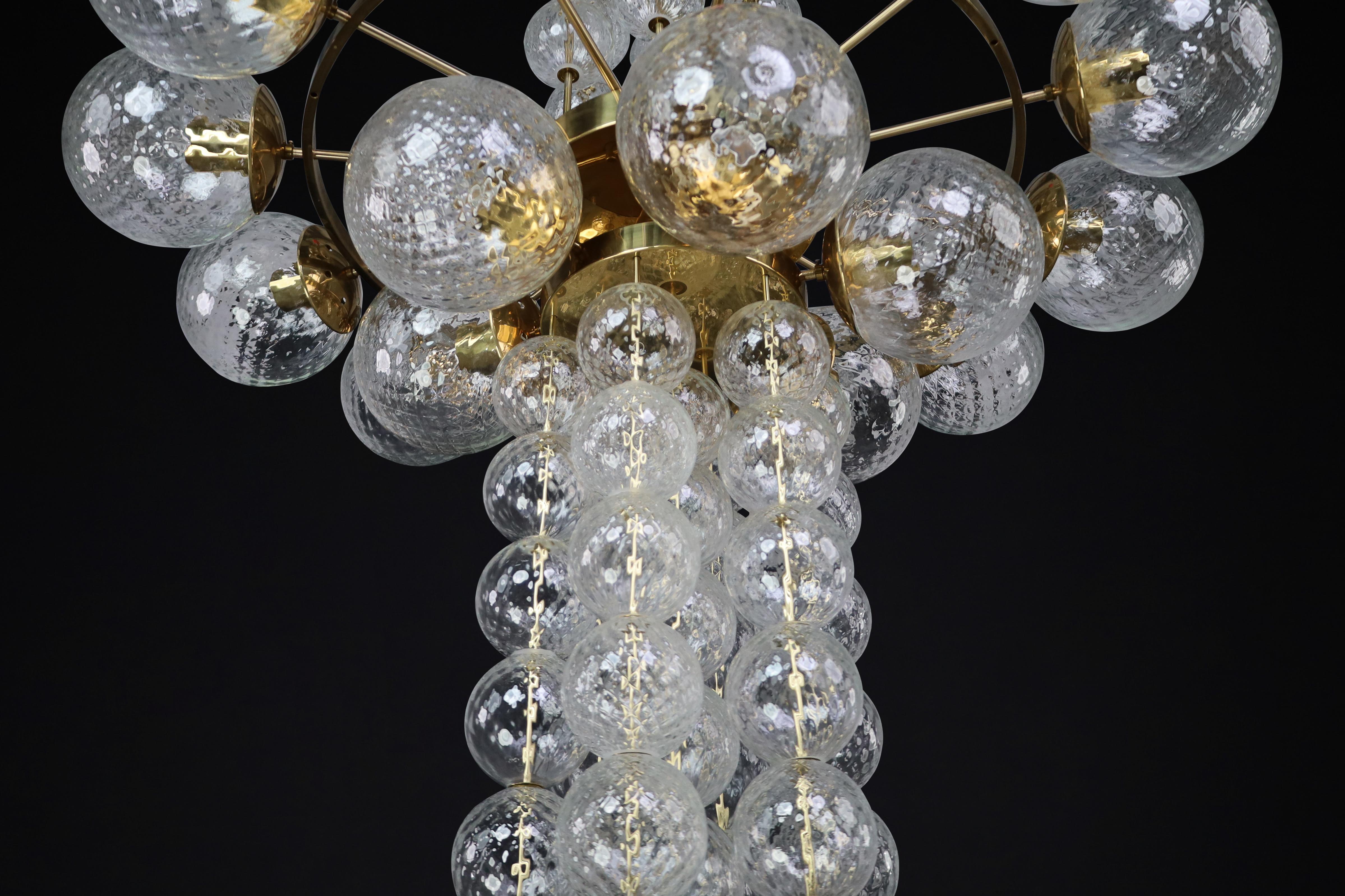 Mid-20th Century Large Chandelier with brass fixture and hand-blowed glass globes by Preciosa Cz. For Sale