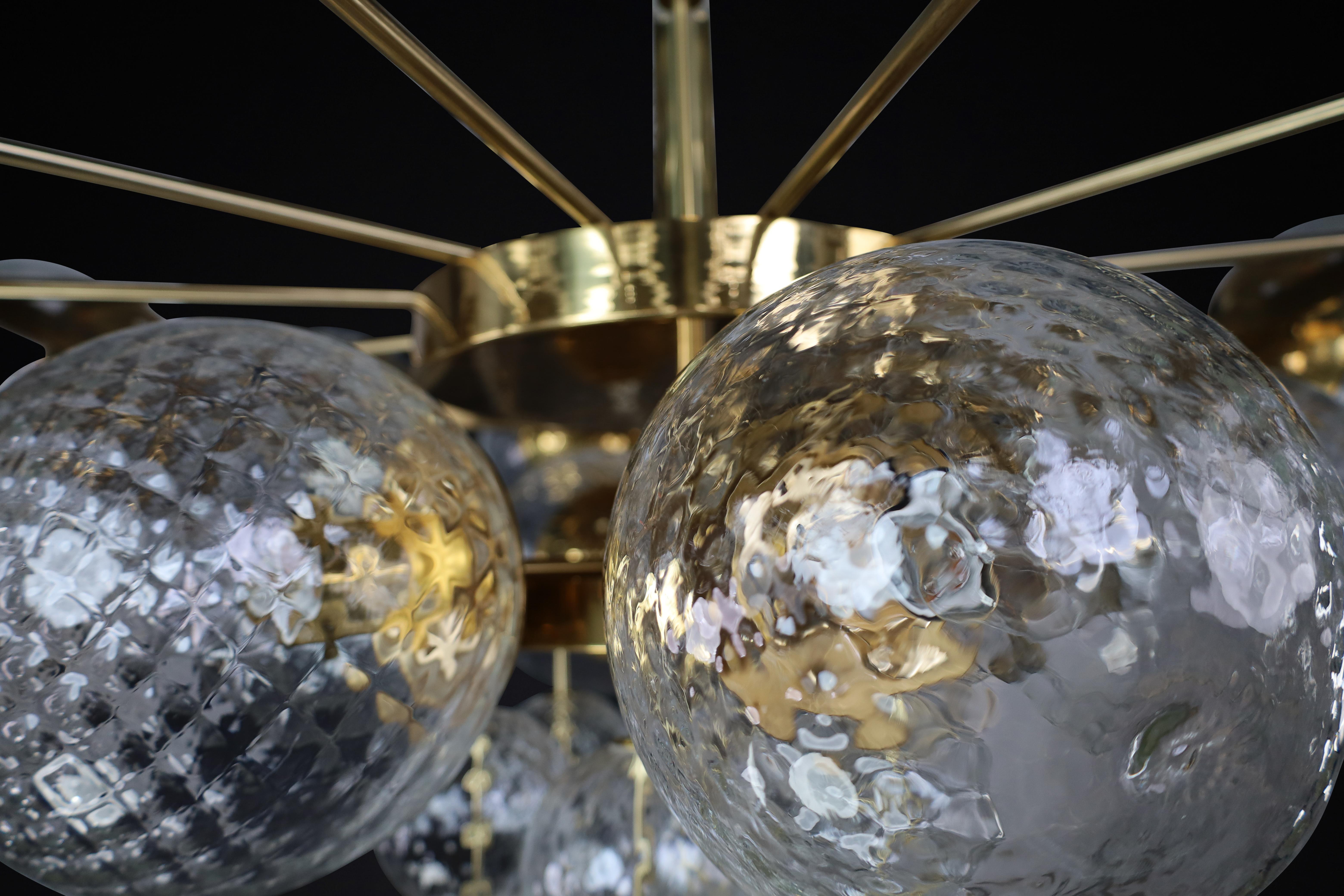 Brass Large Chandelier with brass fixture and hand-blowed glass globes by Preciosa Cz. For Sale