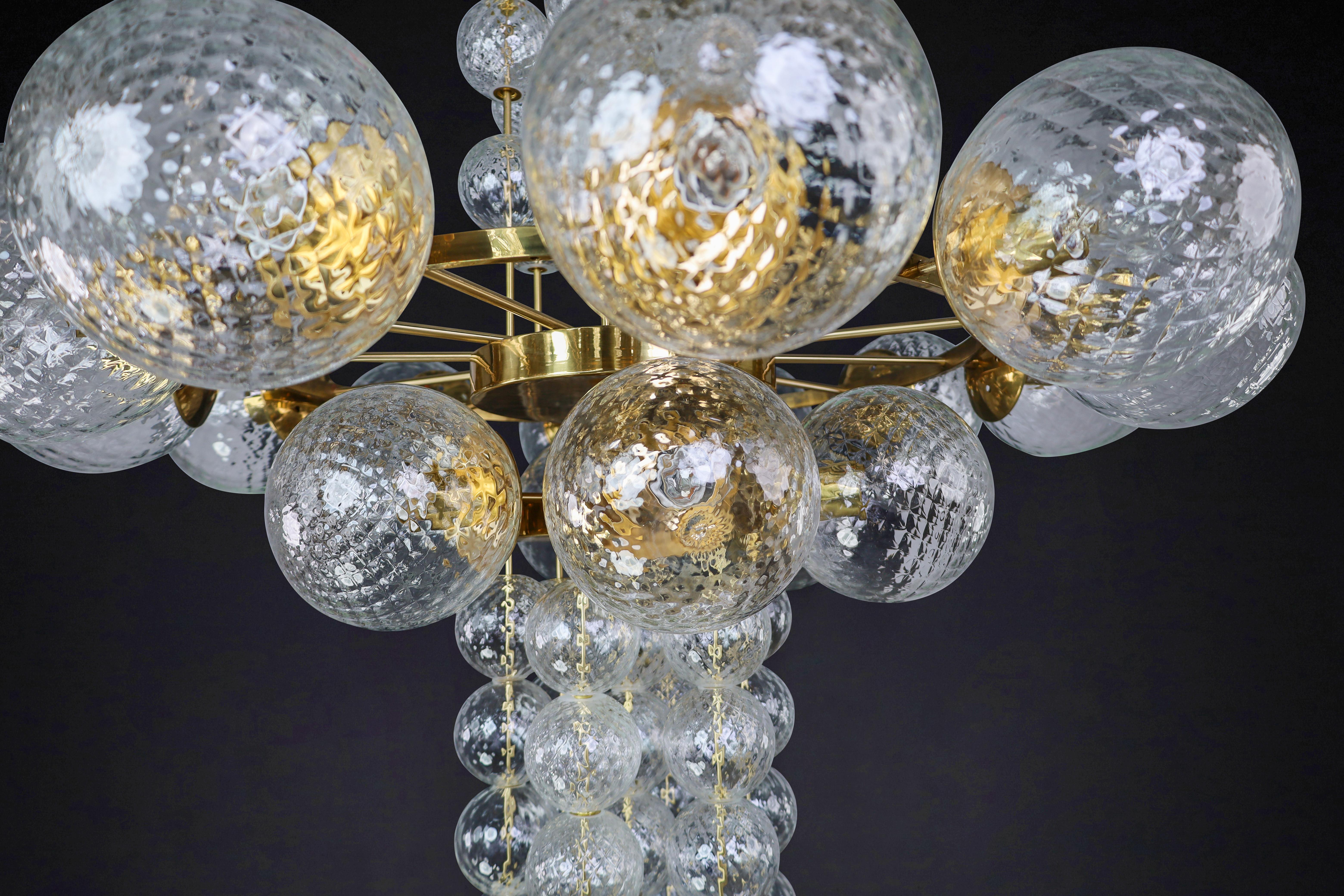 Large Chandelier with brass fixture and hand-blowed glass globes by Preciosa Cz. For Sale 1
