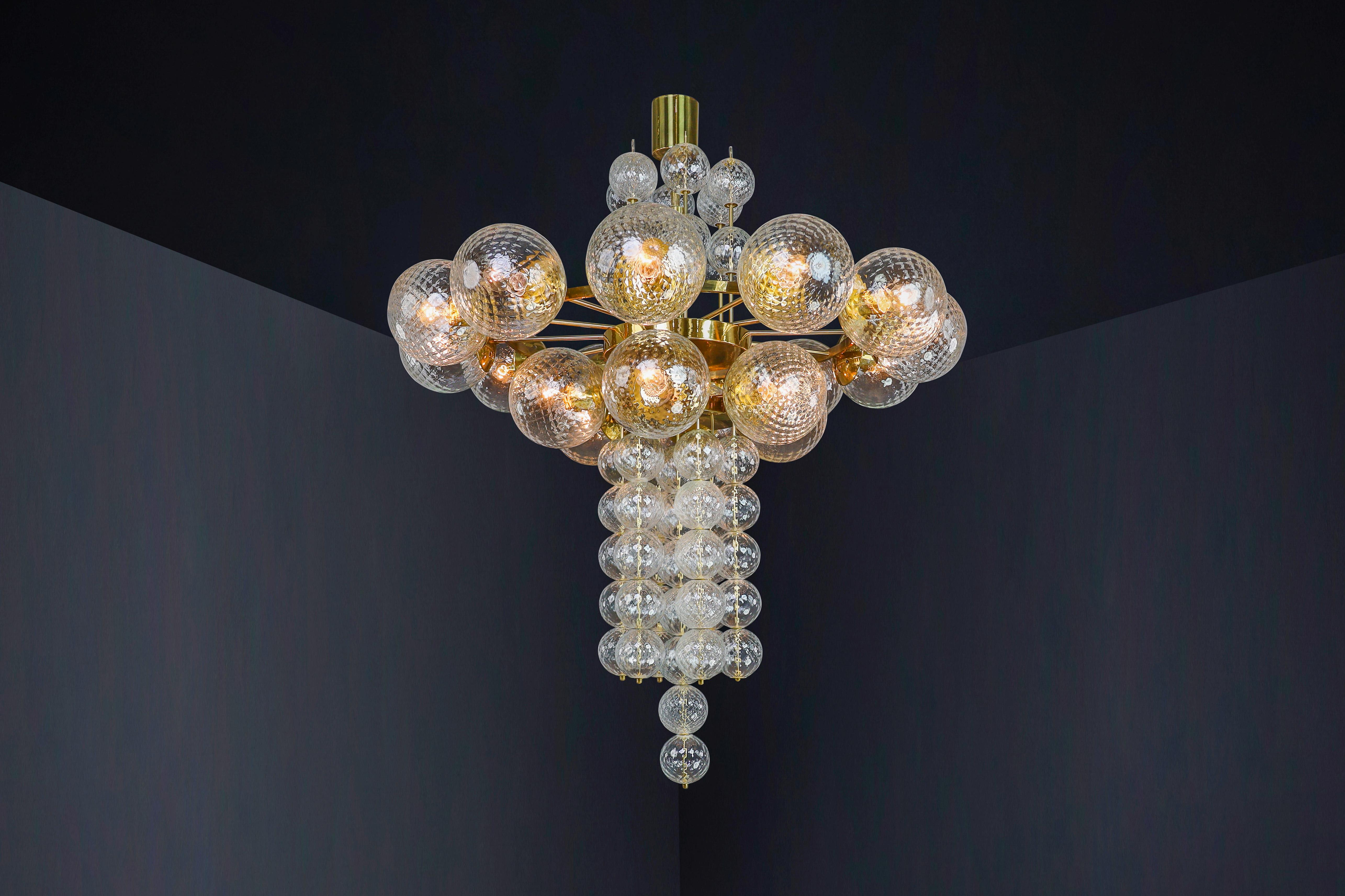 Large Chandelier with brass fixture and hand-blowed glass globes by Preciosa Cz. For Sale 2
