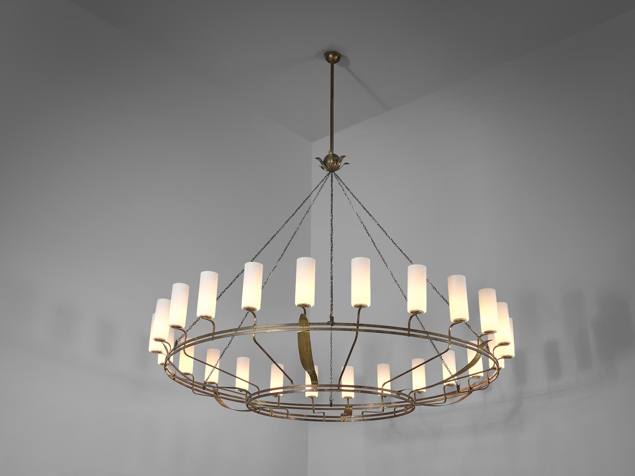 Large chandelier, patinated brass, glass, Europe, 1940s

This highly elegant chandelier is very impressive in its size and execution. Made in Europe in the 1940s, this chandelier shows traits and detailing of the late Art Deco period. The structure
