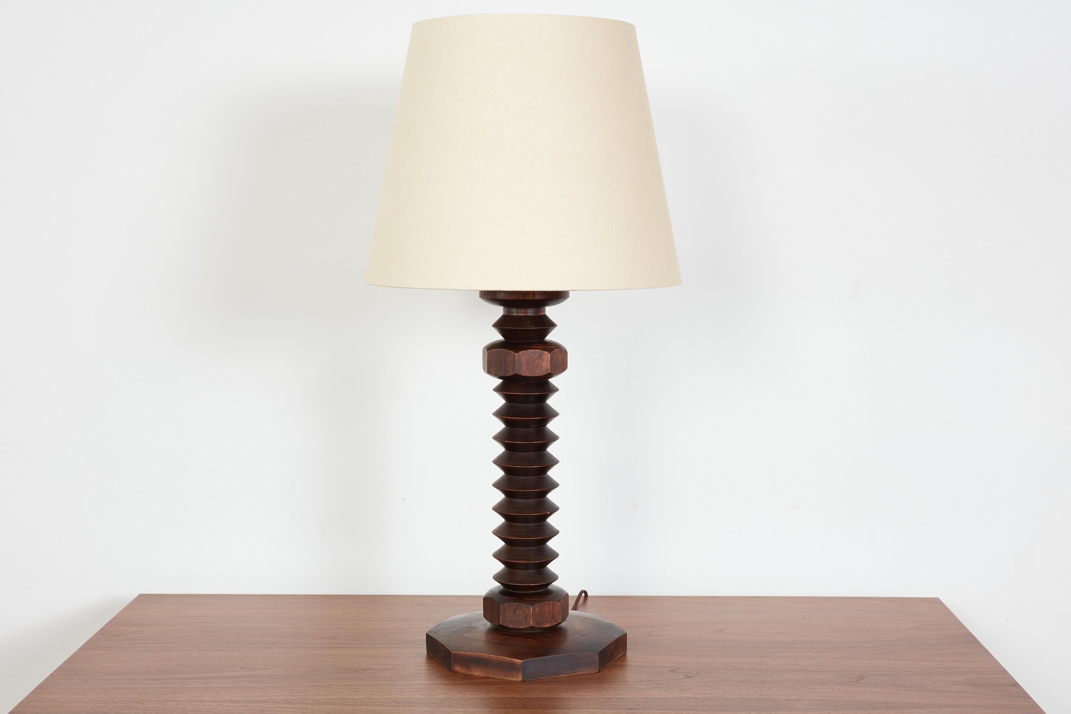 Large Scale Charles Dudouyt table lamp with signature chunky corkscrew base.
Great shape and wood patina. 

Newly rewired with new Linen Shade. 
