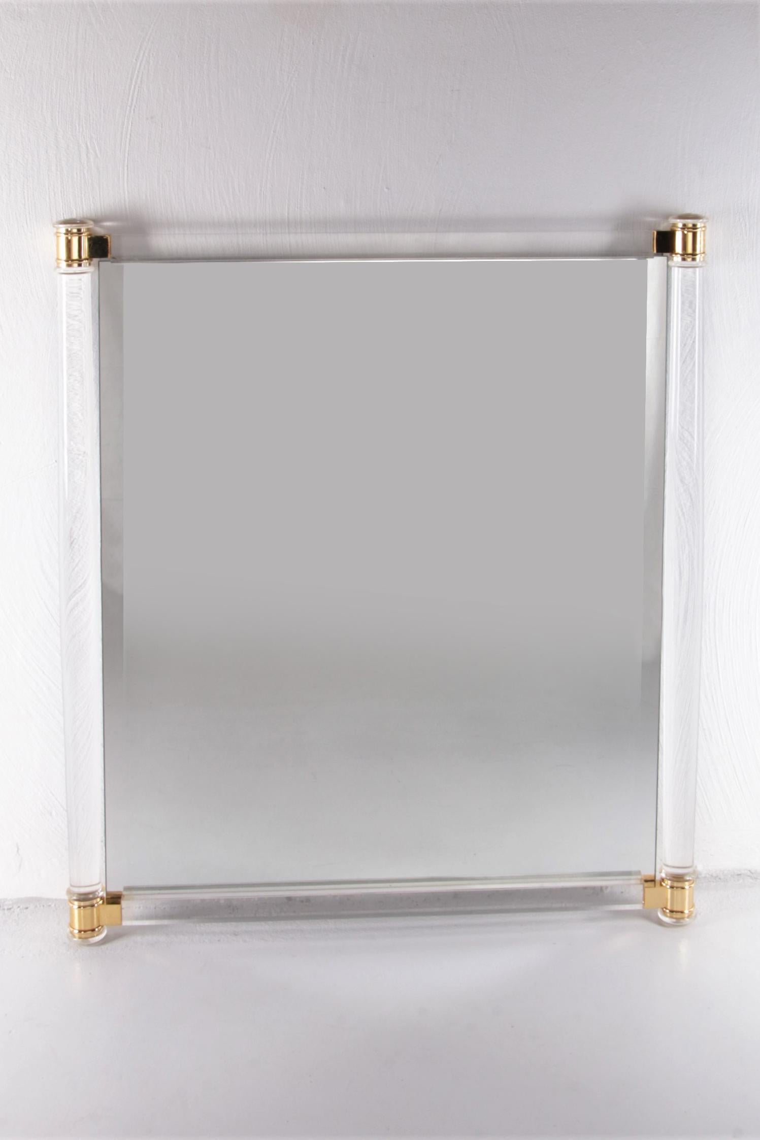 Large Charles Hollis Jones Plexiglass wall mirror, 1970 USA

This is a large wall mirror with a beautiful round Plexiglas edge with brass details.

This mirror is easy to hang because there are 2 mounting brackets on the back.

The mirror is a
