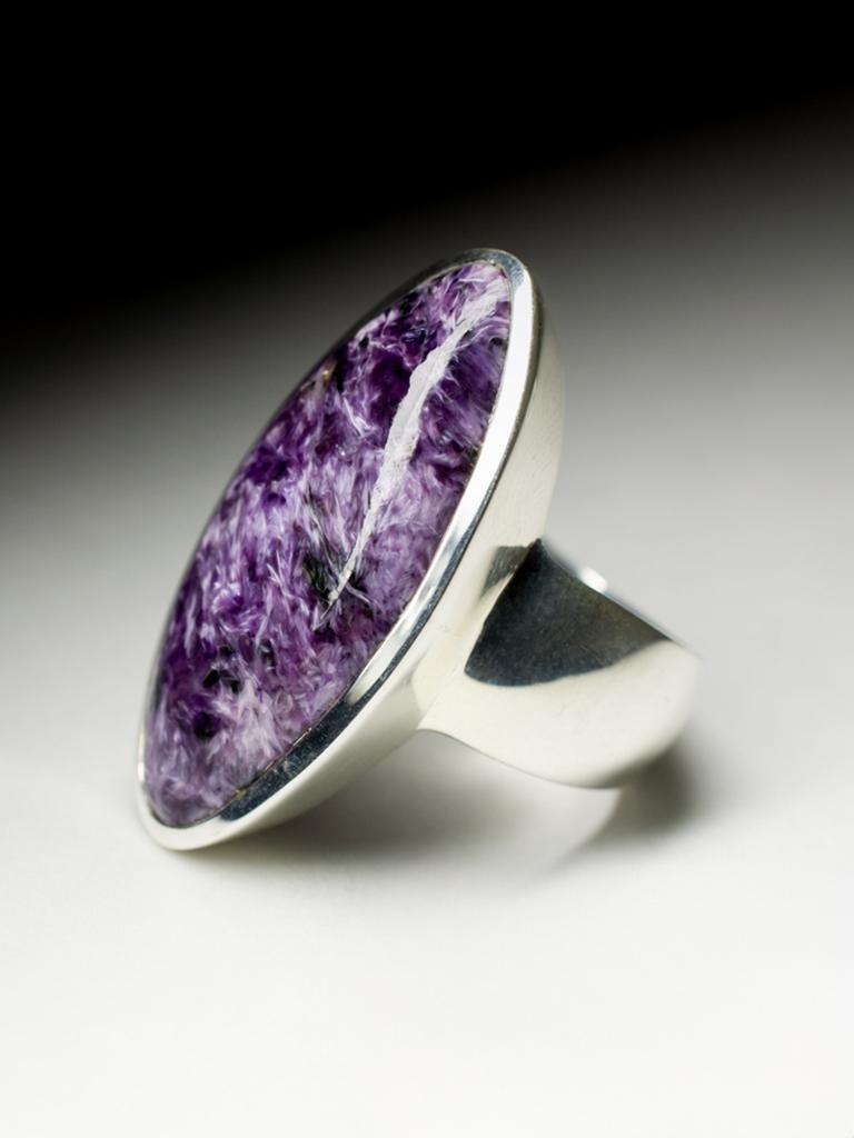 Large silver ring with natural fine quality Charoite
stone measurements - 0.24 х 0.59 х 1.3 in / 6 х 15 х 33 mm
charoite weight - 17.4 carats
ring weight - 16.19 grams
ring size - 9.25 US