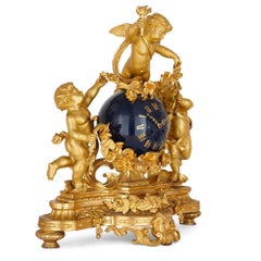 Large cherub-themed gilt bronze clock garniture by Popon