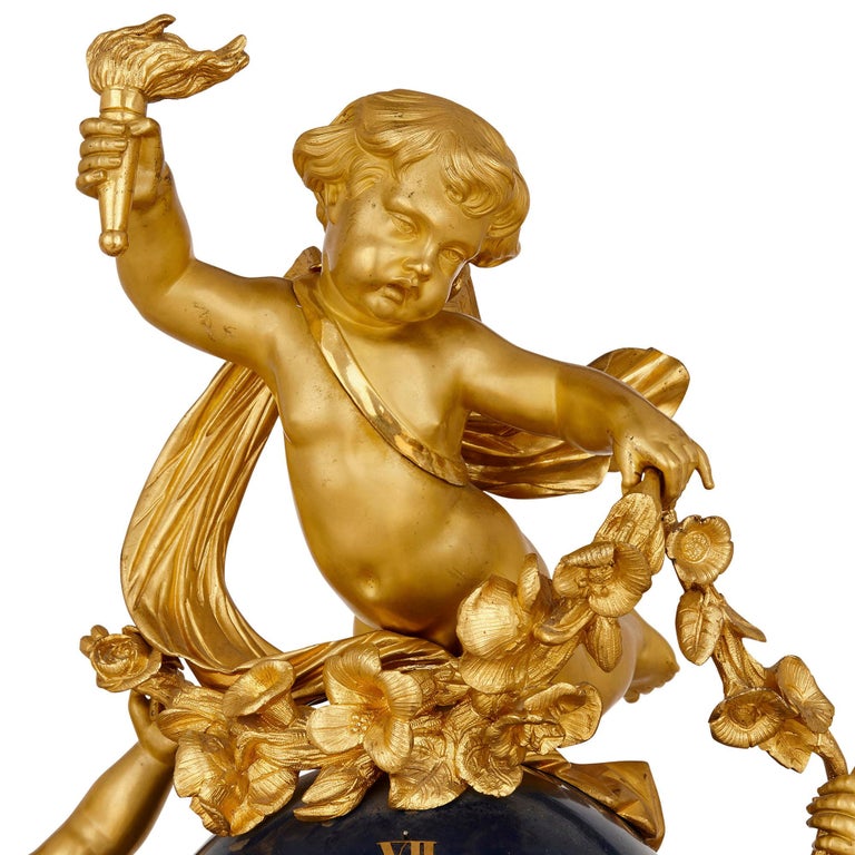 Gilt Large cherub-themed gilt bronze clock garniture by Popon For Sale