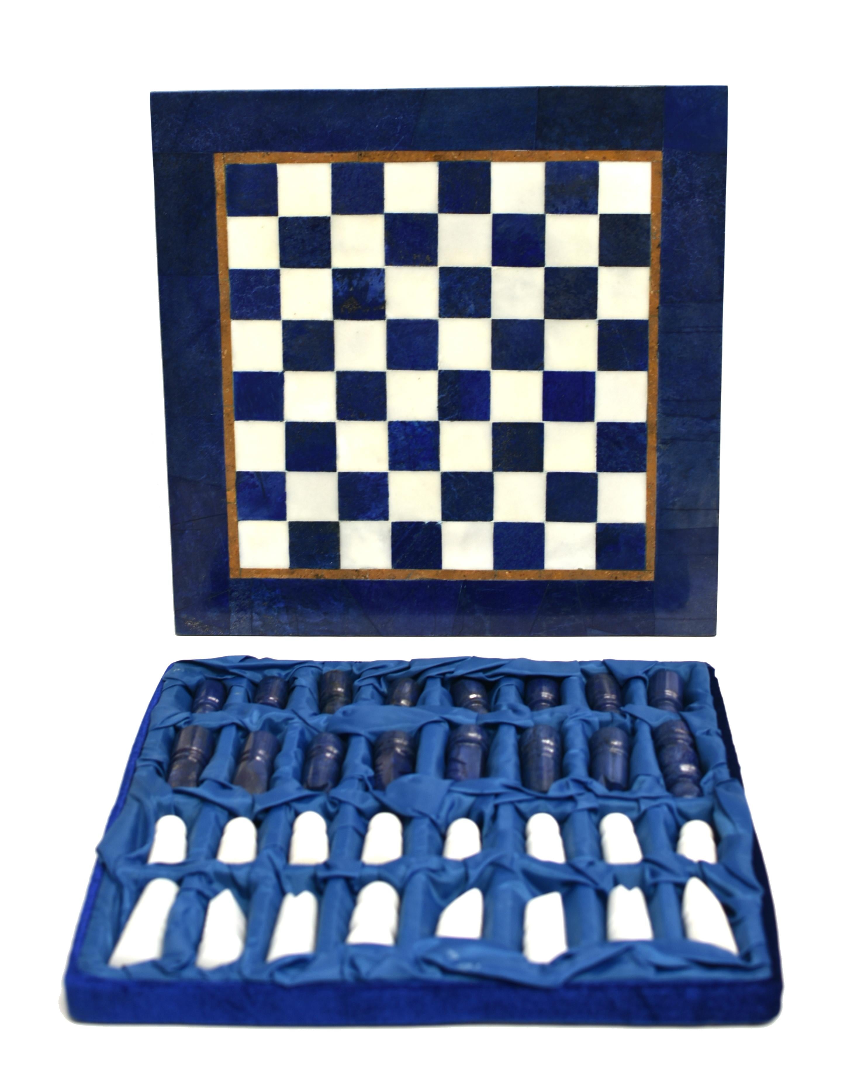 A large, elegant gemstone chess set. The set is with hand-cut genuine lapis lazuli and Carrara marble squares, and an inlaid border of butterscotch granite, all meticulously arranged to create a luxurious game board. Polished to perfect smoothness