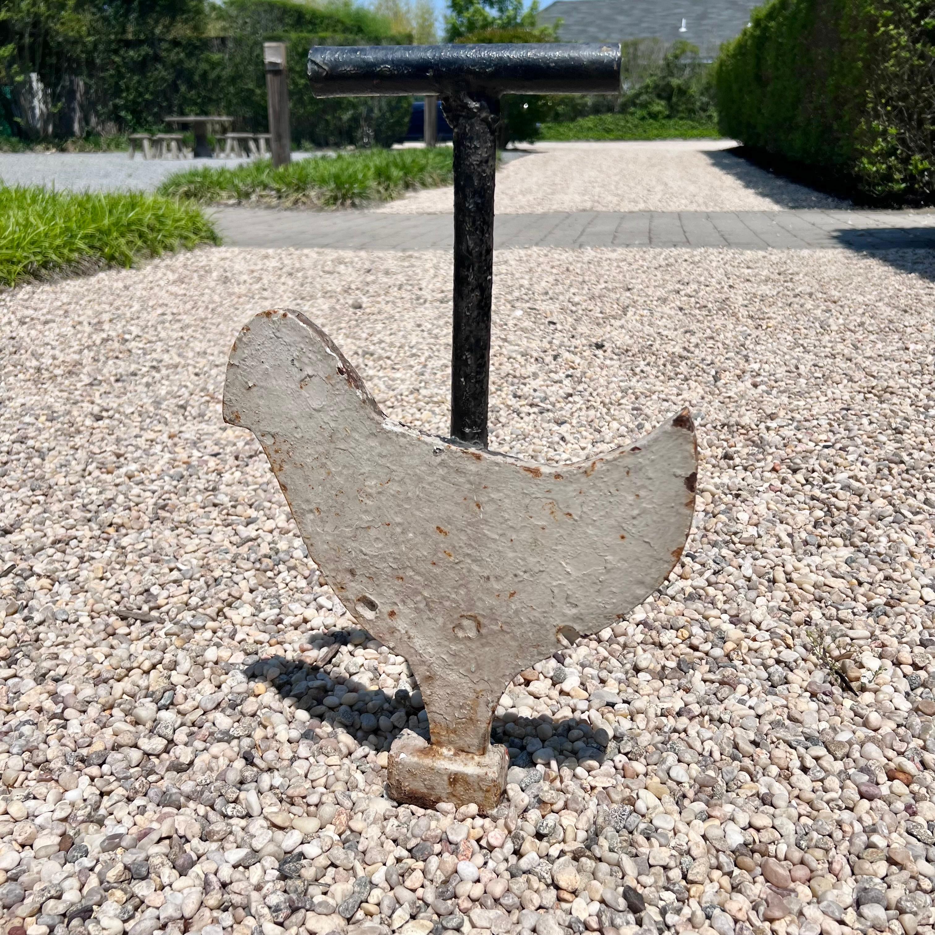 Very interesting heavy metal shooting target. Figure of a large chicken is attached to a metal post with a hollow tube at the top which a cable would run through suspending this target in the air. Figure is on a hinge so when you hit the target, the