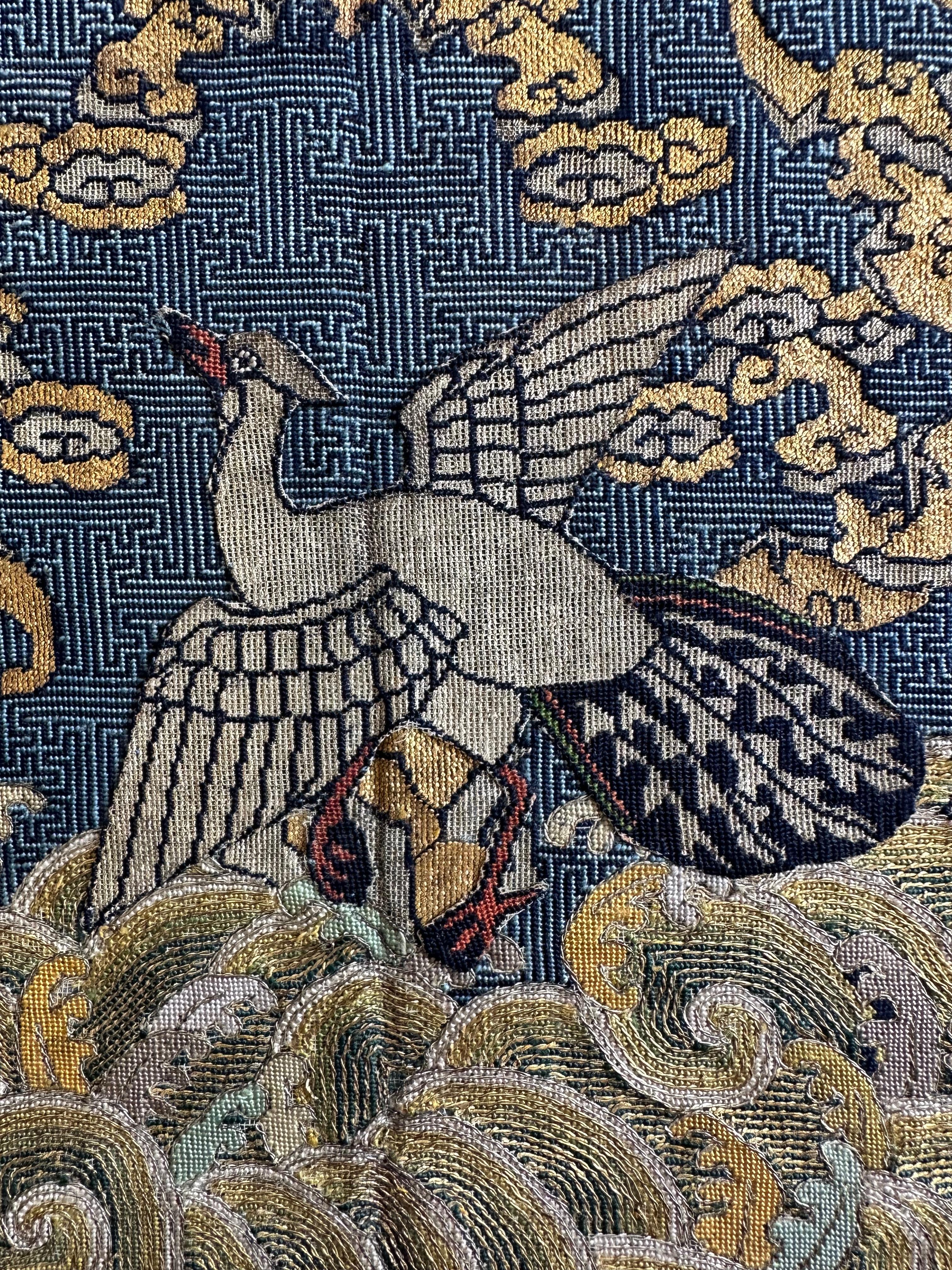 Qing Dynasty brocade civil rank badge with silver pheasant, likely intended for the front of a child's robe.

This unusually-sized badge was probably made for an older child of a civil official of the fifth rank. It features a silver pheasant, which